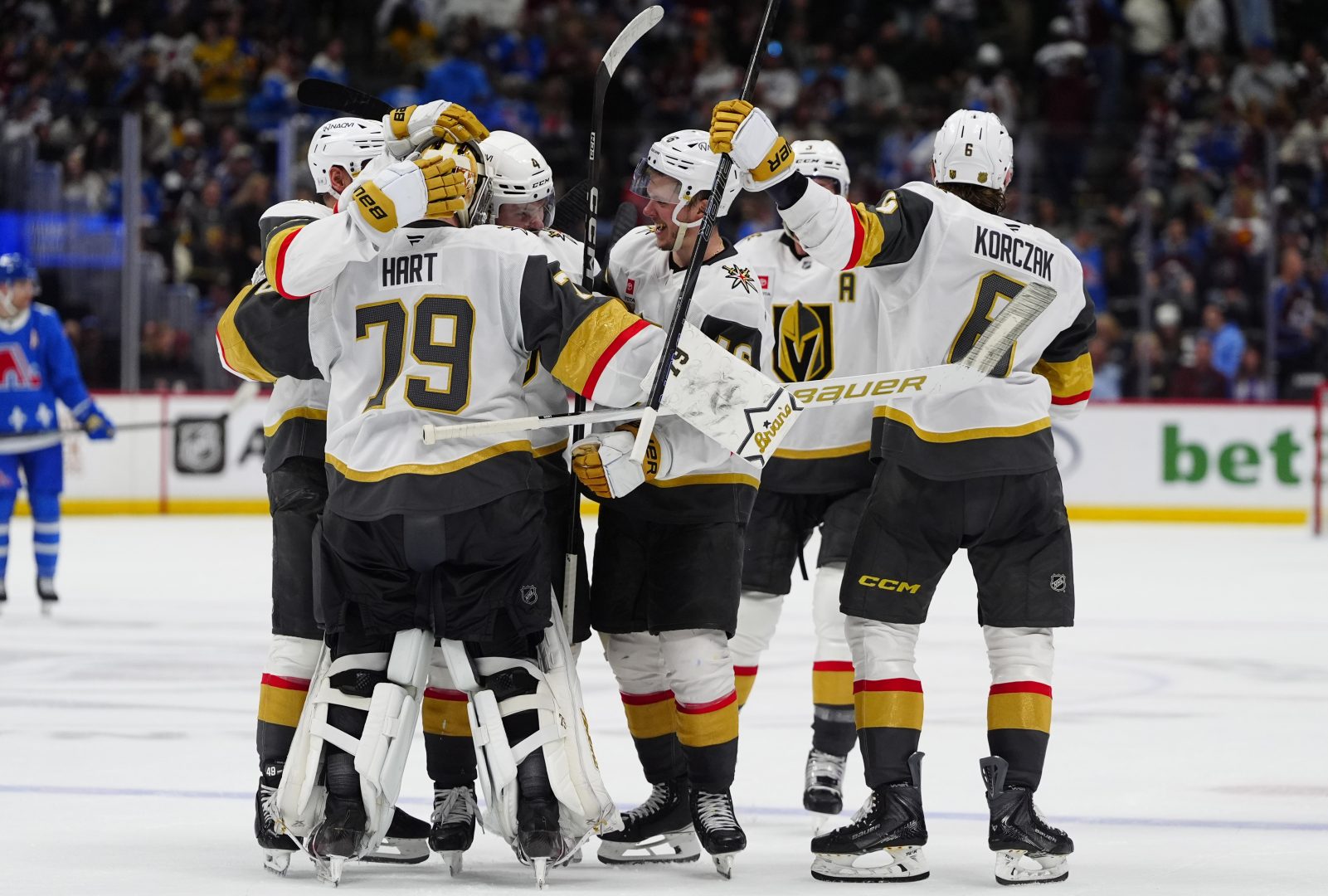Vegas Golden Knights players celebrate after an overtime win over the Avalanche at Ball Arena that clinched a playoff spot and moved Vegas into first place in the Pacific.