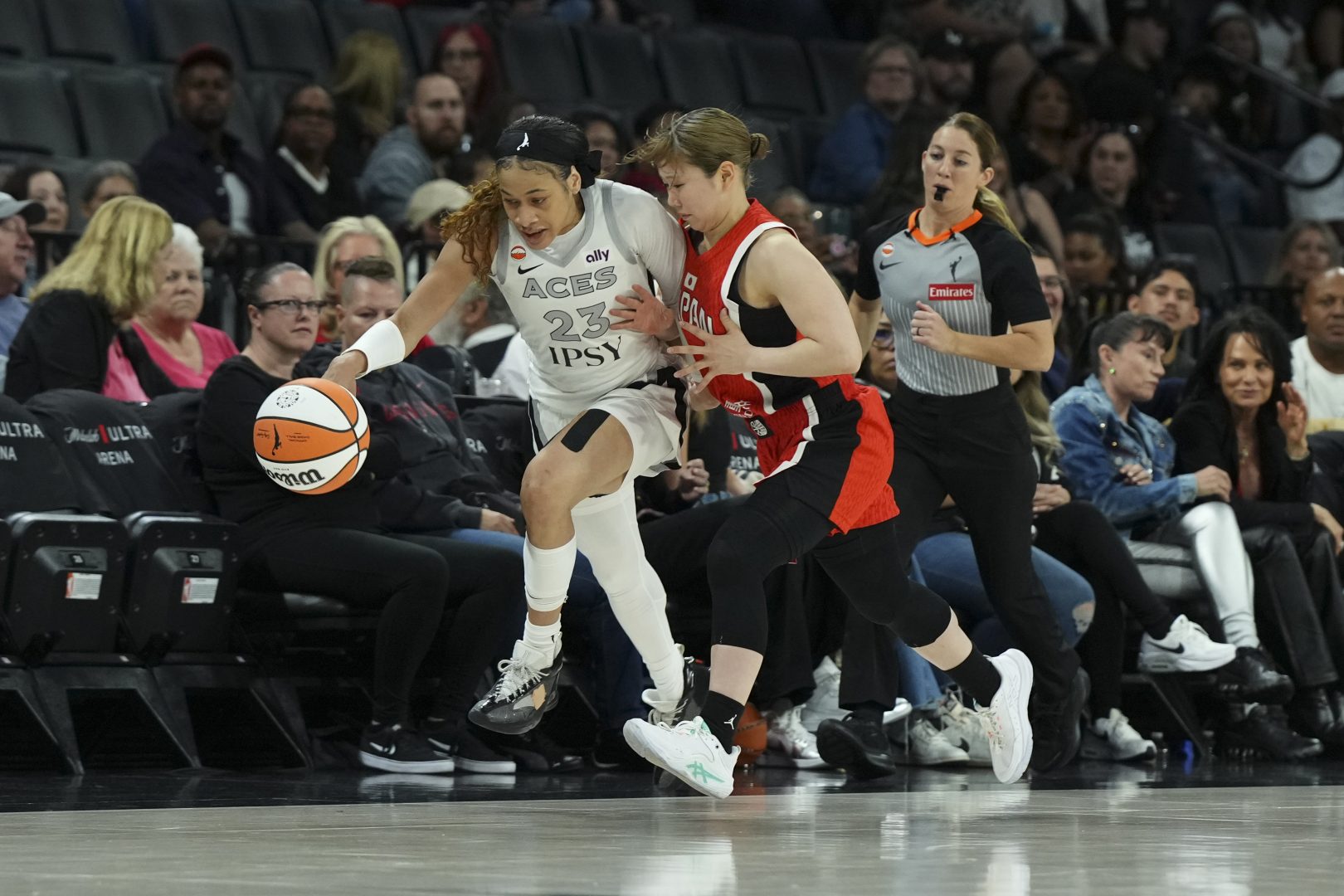 Chennedy Carter dribbles for the Aces while guarded by Japan’s Nanami Tsuno in the first quarter at Michelob ULTRA Arena.