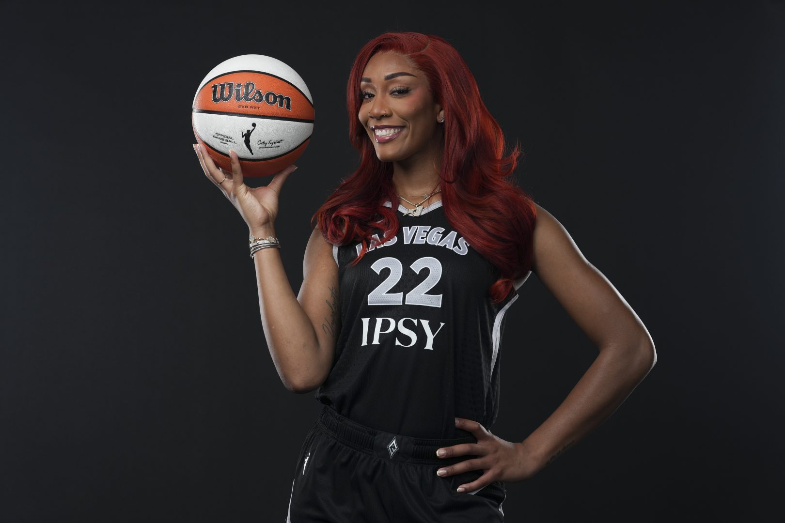 Las Vegas Aces center A’ja Wilson (22) poses during 2026 team media day in Las Vegas with her red hair inspired by Jean Grey.