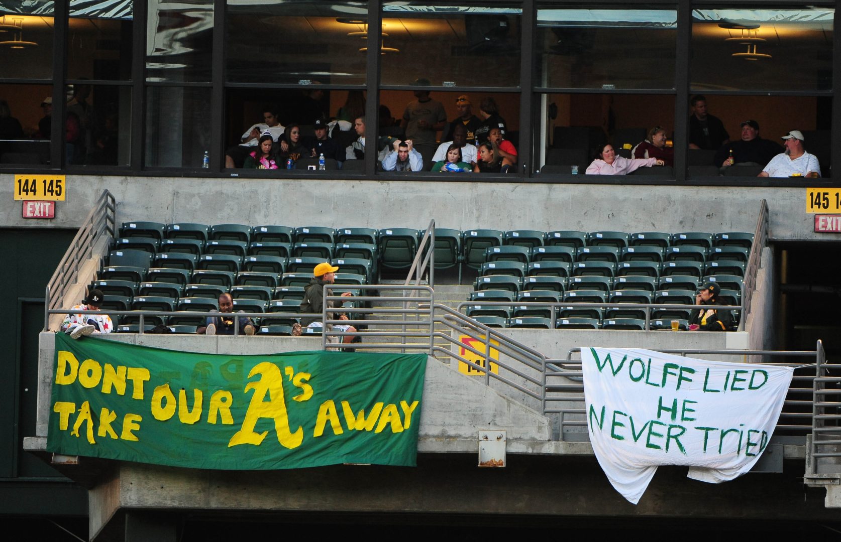 Oakland Athletics fans hang protest banners from the Coliseum bleachers during a June 7, 2024 game against the Blue Jays, opposing the team’s proposed move to Las Vegas.