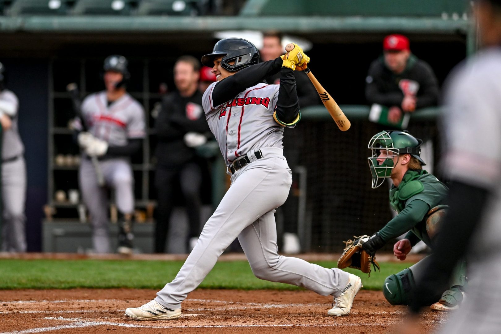 Brayan Buelvas swings during a game with the Lansing Lugnuts, driving in a run in the fourth inning at Jackson Field in Lansing, Michigan.