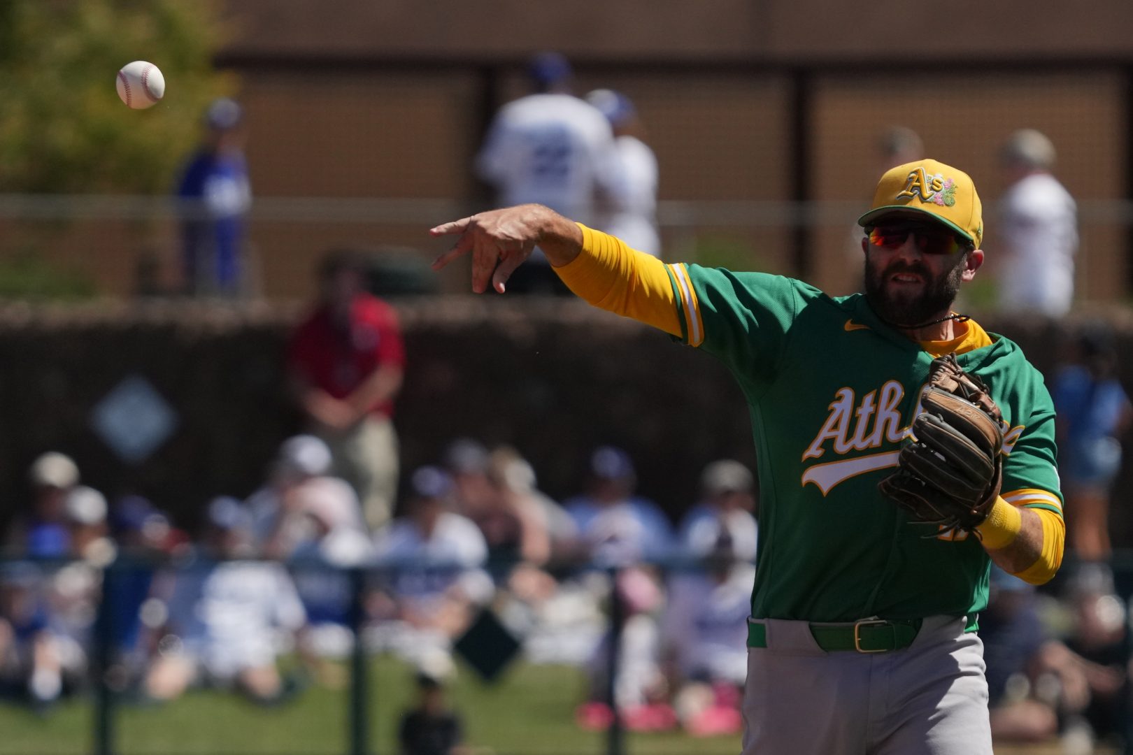 Athletics second baseman Michael Stefanic throws to first base during a spring training game against the Los Angeles Dodgers at Camelback Ranch-Glendale on March 21, 2026.