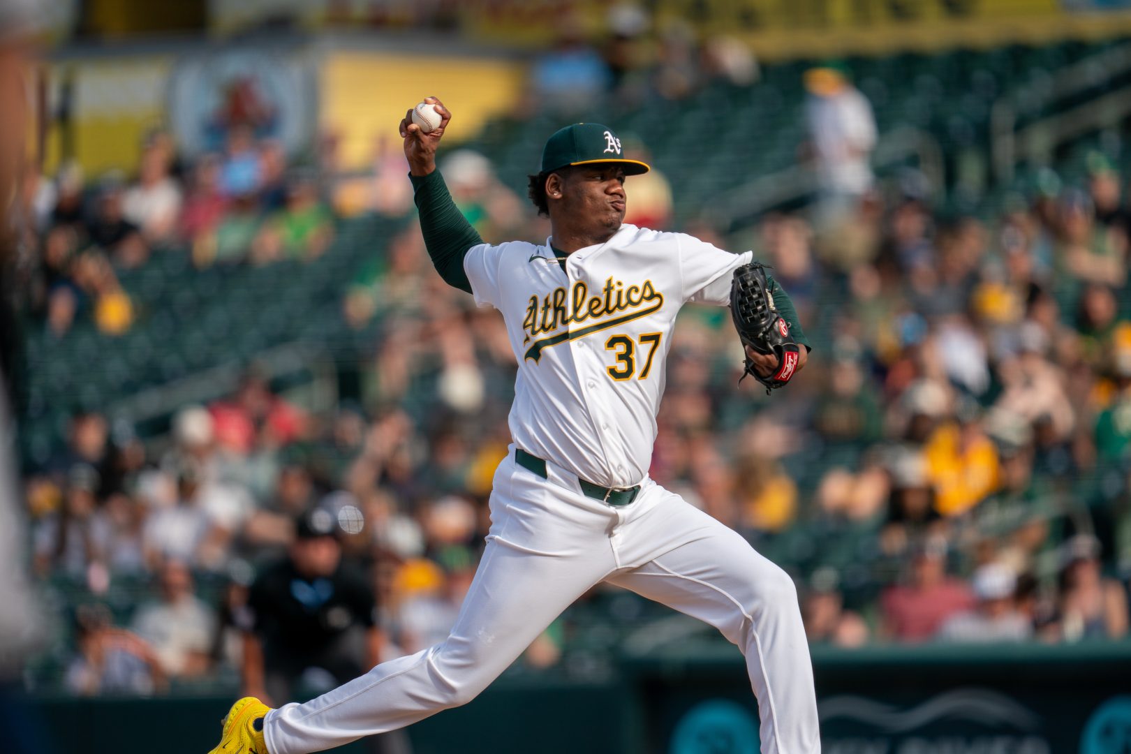 Athletics pitcher Elvis Alvarado throws a pitch during the tenth inning at Sutter Health Park, working in a high-leverage situation late in the game.