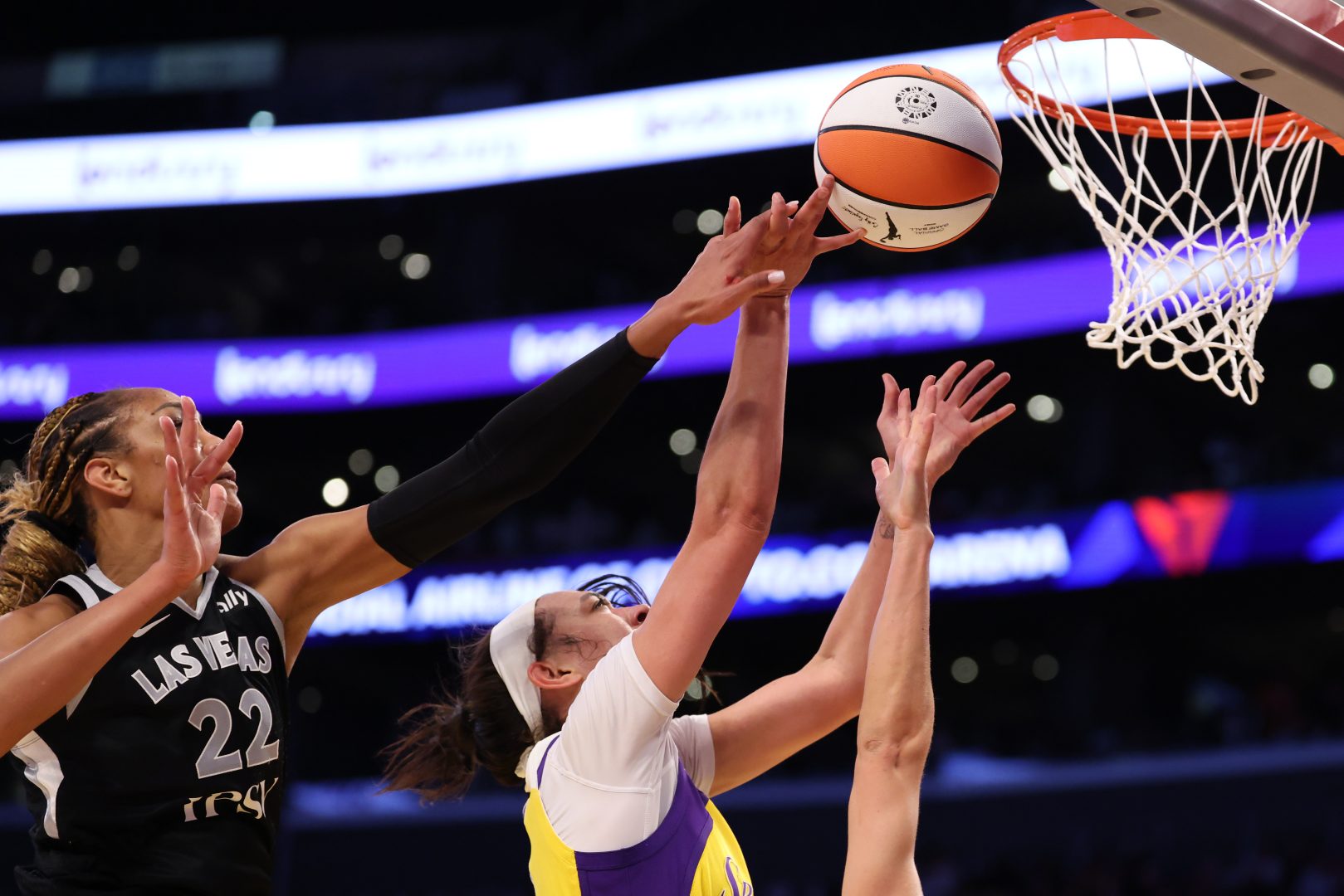 A’ja Wilson blocks a shot by Los Angeles Sparks forward Dearica Hamby during the Las Vegas Aces’ game at Crypto.com Arena.