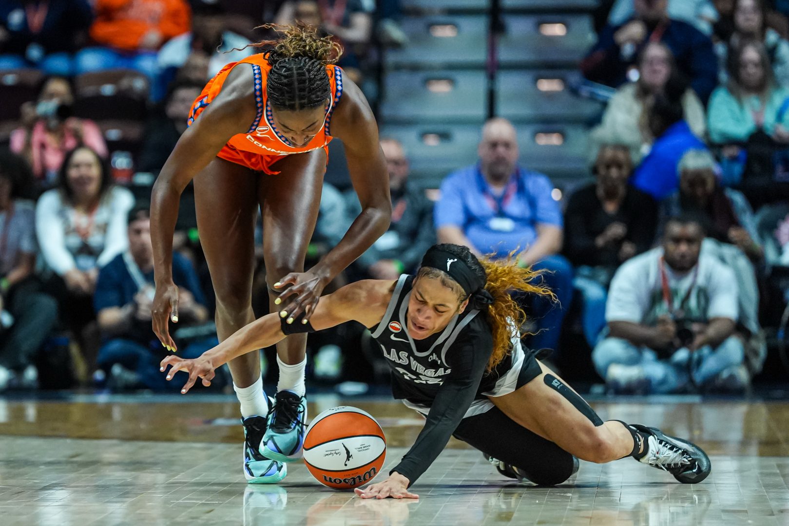 Chennedy Carter works for the ball against Connecticut Sun forward Diamond Miller during the Las Vegas Aces’ game at Mohegan Sun Arena.
