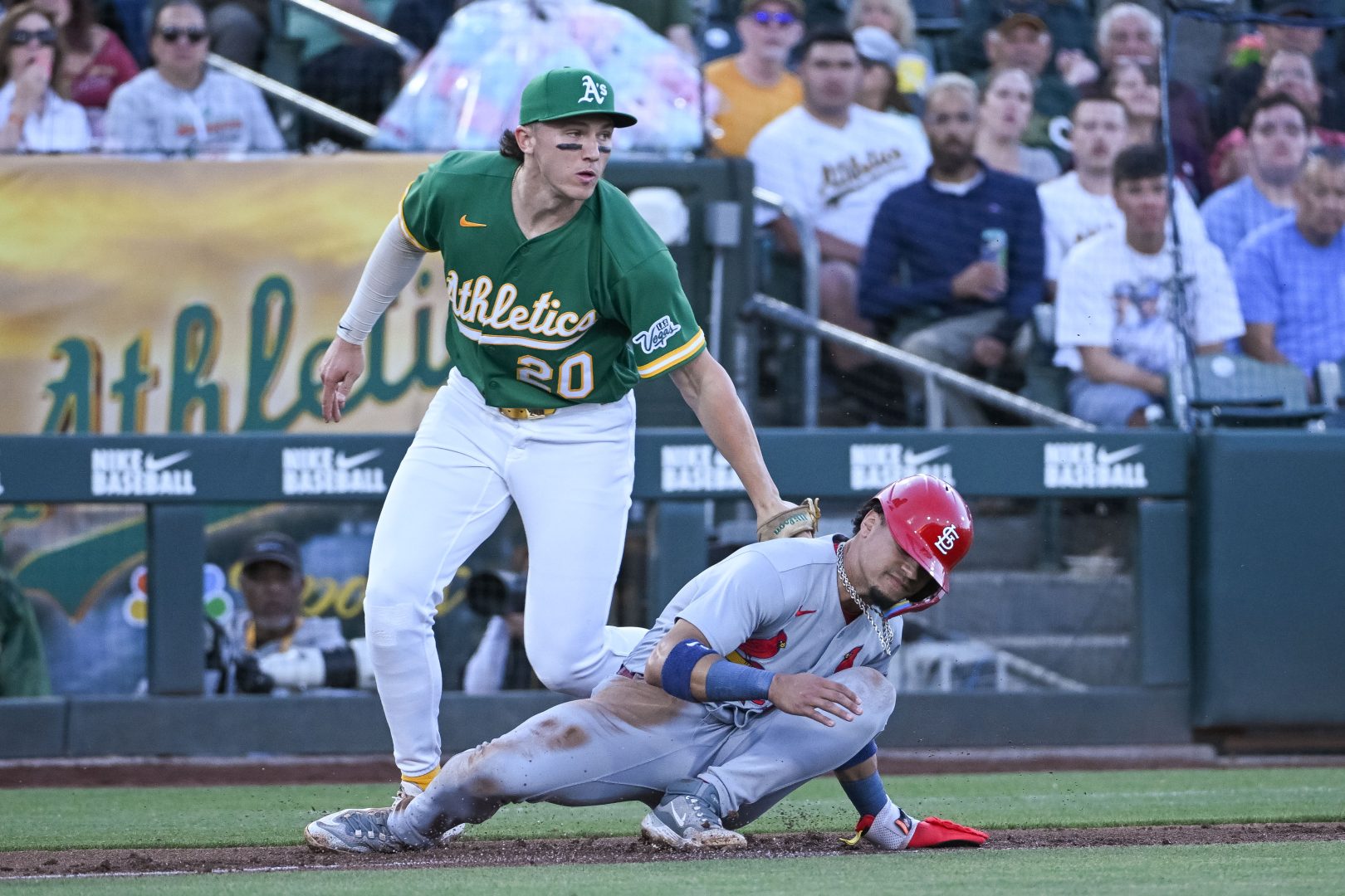 Zack Gelof tags Masyn Winn during the fourth inning at Sutter Health Park.