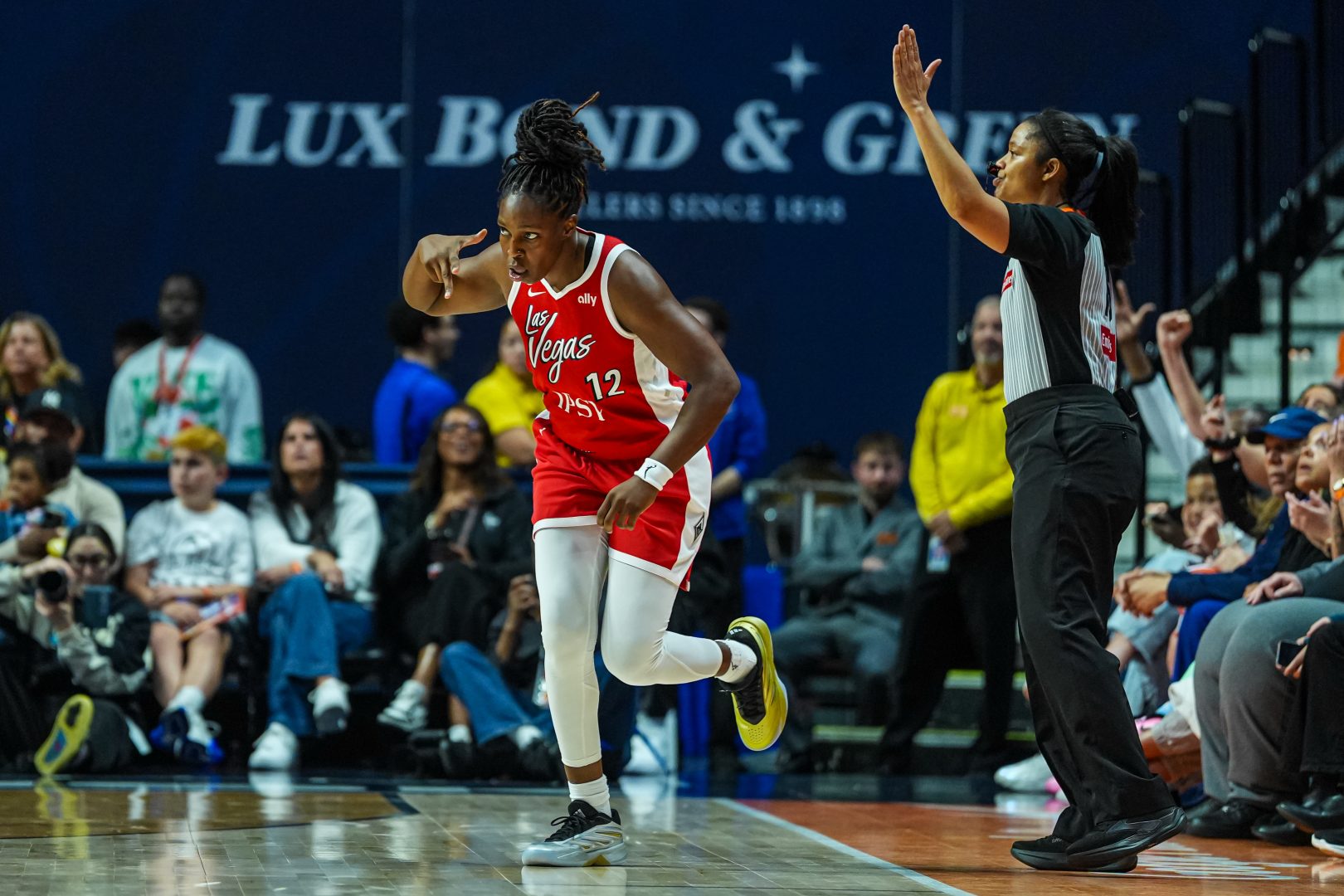 Chelsea Gray reacts after making a three-point basket during the Las Vegas Aces’ road game against the Connecticut Sun.
