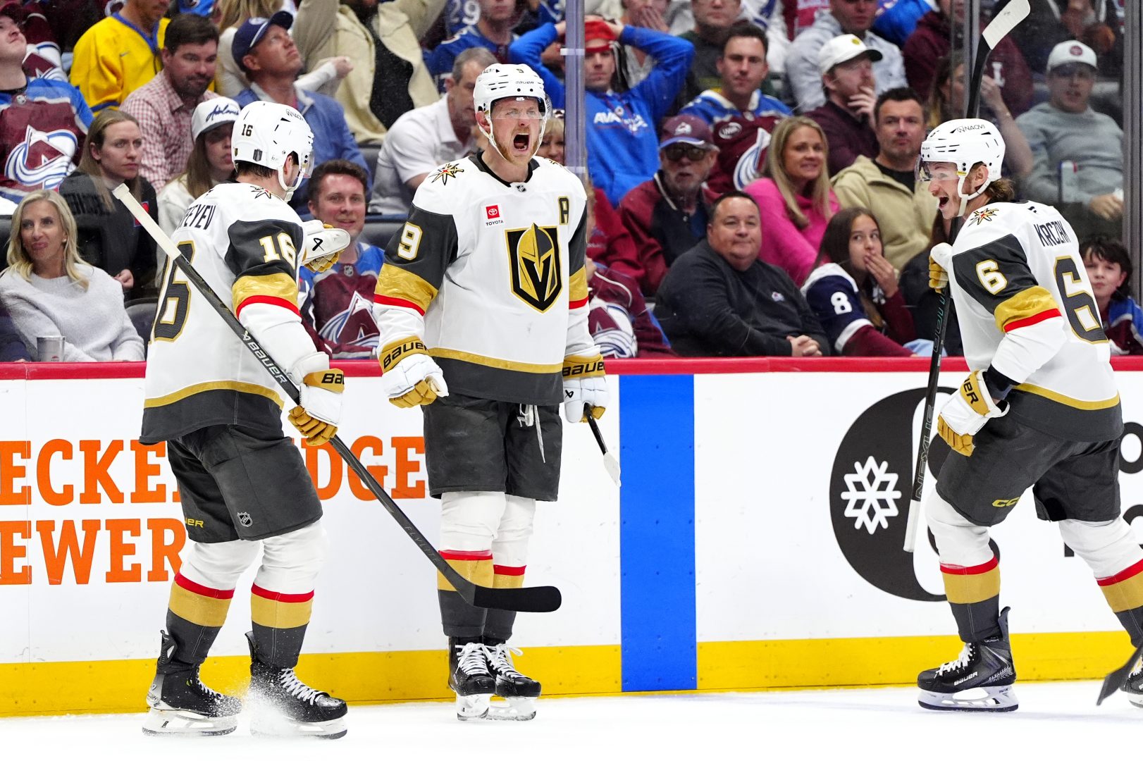 Jack Eichel celebrates a third-period goal with Pavel Dorofeyev and Kaedan Korczak during Game 2 of the Western Conference Final at Ball Arena.