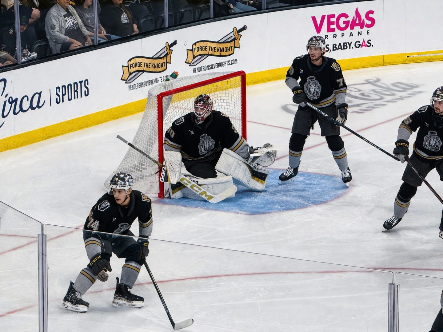Henderson goalie Carl Lindbom (30) guards the crease with defensemen Viliam Kmec (74) and Lucas Johansen (78) in front at Lee’s Family Forum.