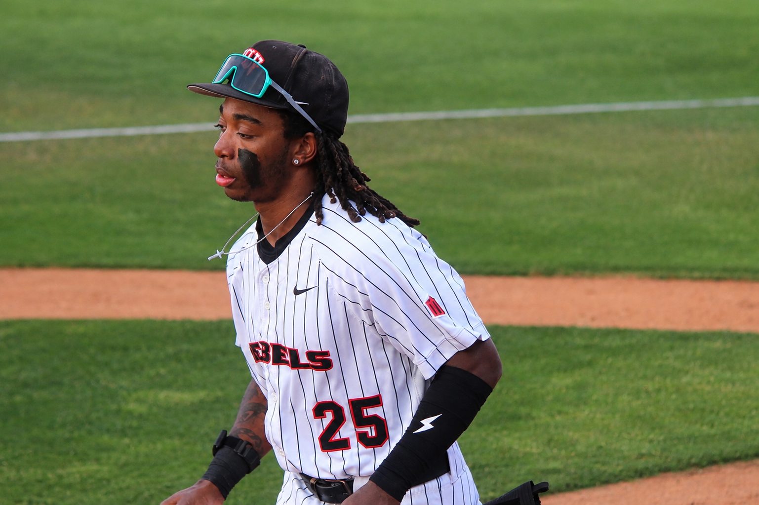 UNLV outfielder Reggie Bussey stands in the dugout during a baseball game earlier in the 2026 season.