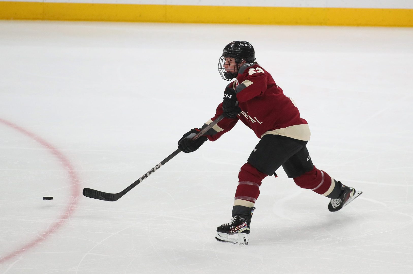 Erin Ambrose shoots the puck