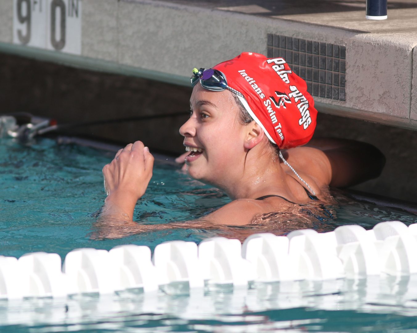 Palm Springs swimmer celebrates her victory in the 500 yard freestyle