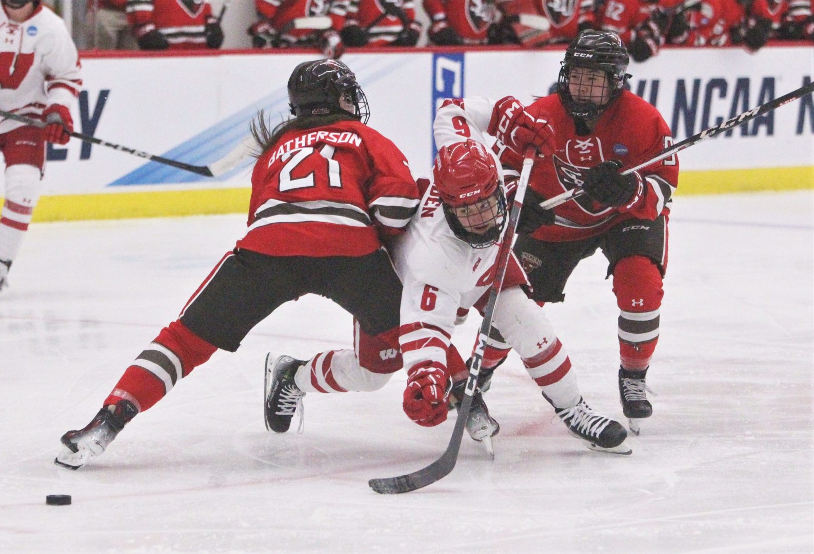 Lacey Eden tries to keep her balance after colliding with St. Lawrence's Mae Batherson