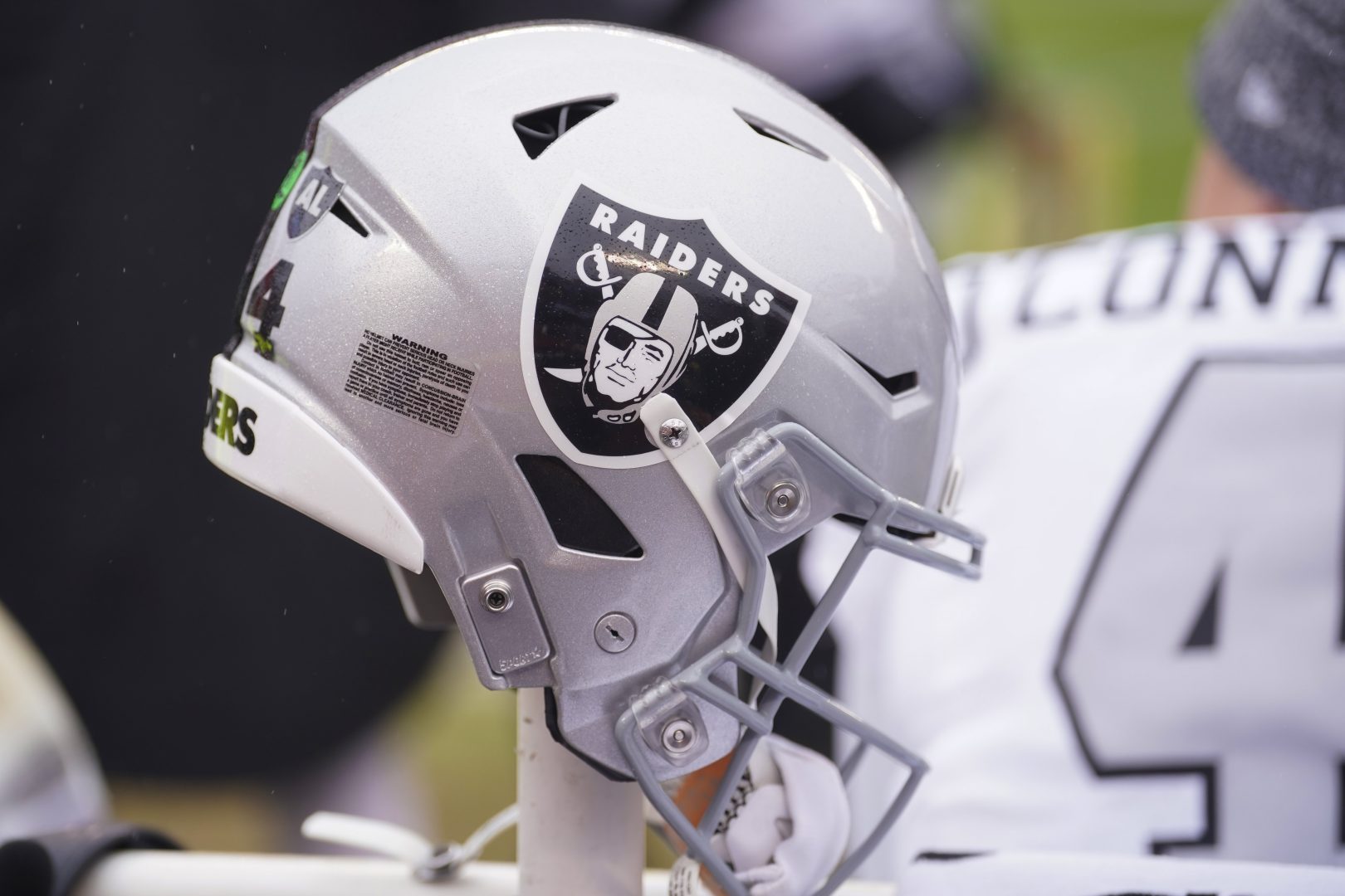 Las Vegas Raiders helmet on the sideline before a game.