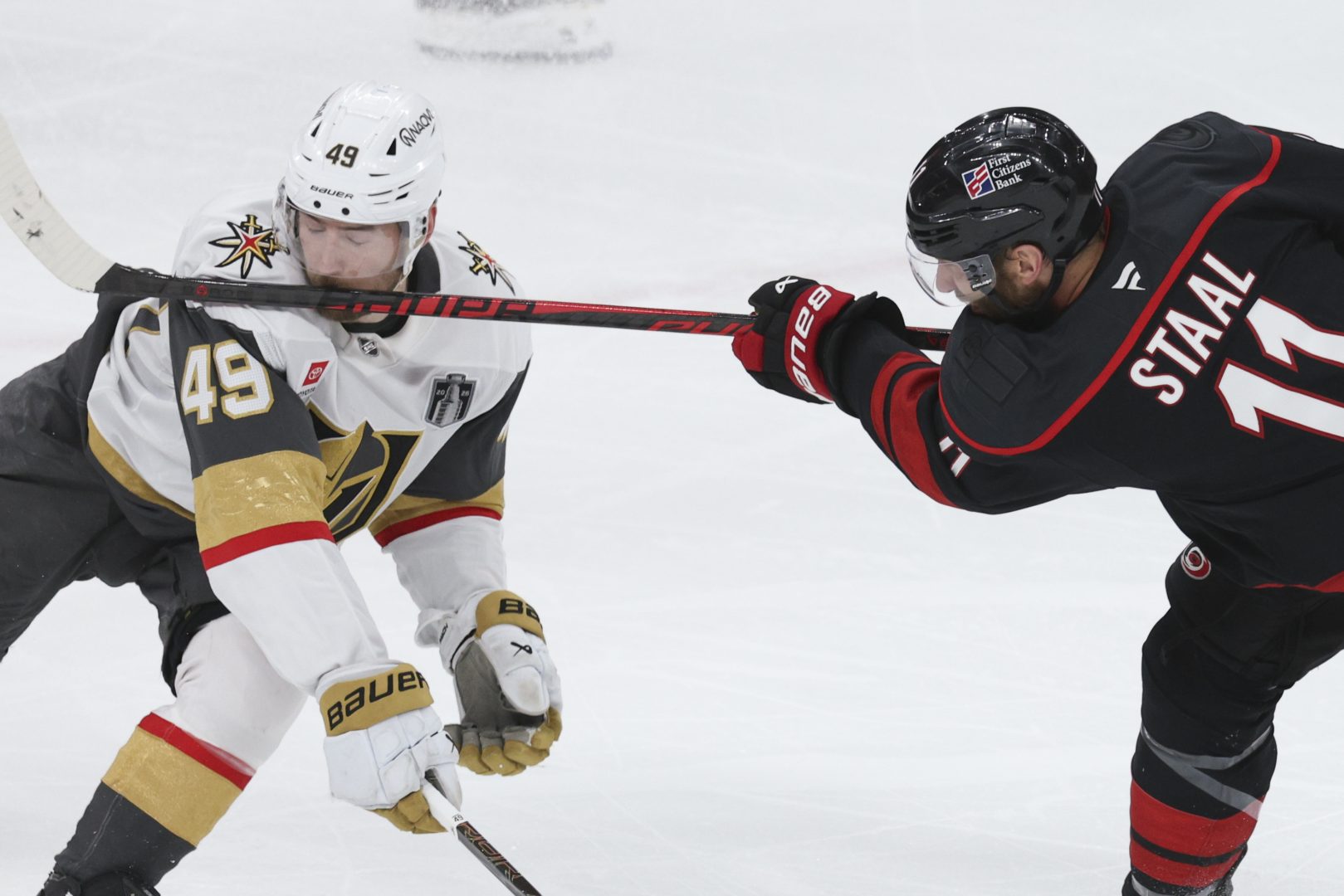 Ivan Barbashev takes a stick to the face from Jordan Staal during Game 2 of the Stanley Cup Final between the Golden Knights and Hurricanes.