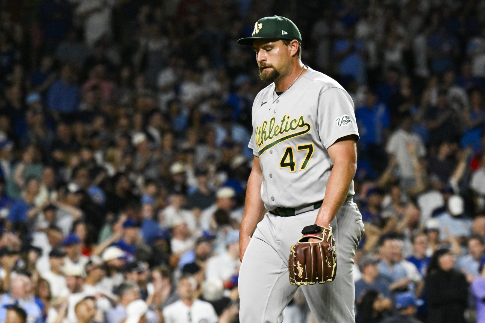 Joel Kuhnel walks to the dugout during a ninth-inning pitching change against the Chicago Cubs.
