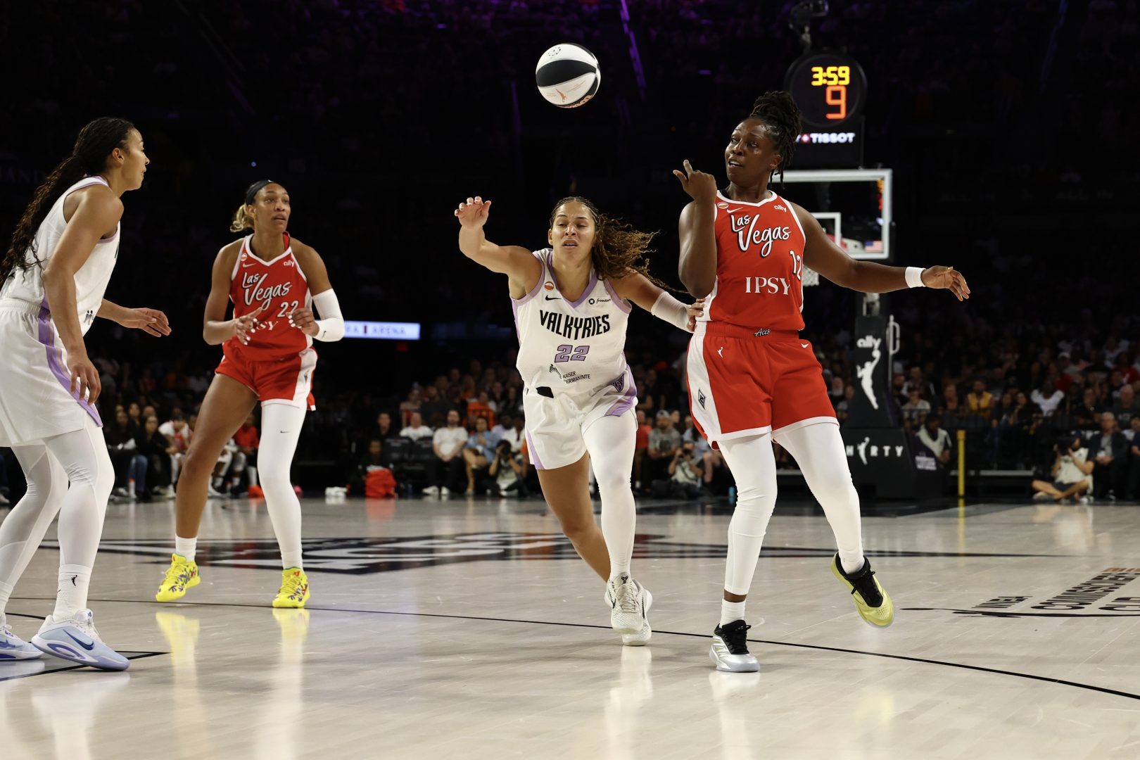 Las Vegas Aces guard Chelsea Gray throws a behind-the-back pass to A’ja Wilson against the Golden State Valkyries at Michelob ULTRA Arena.