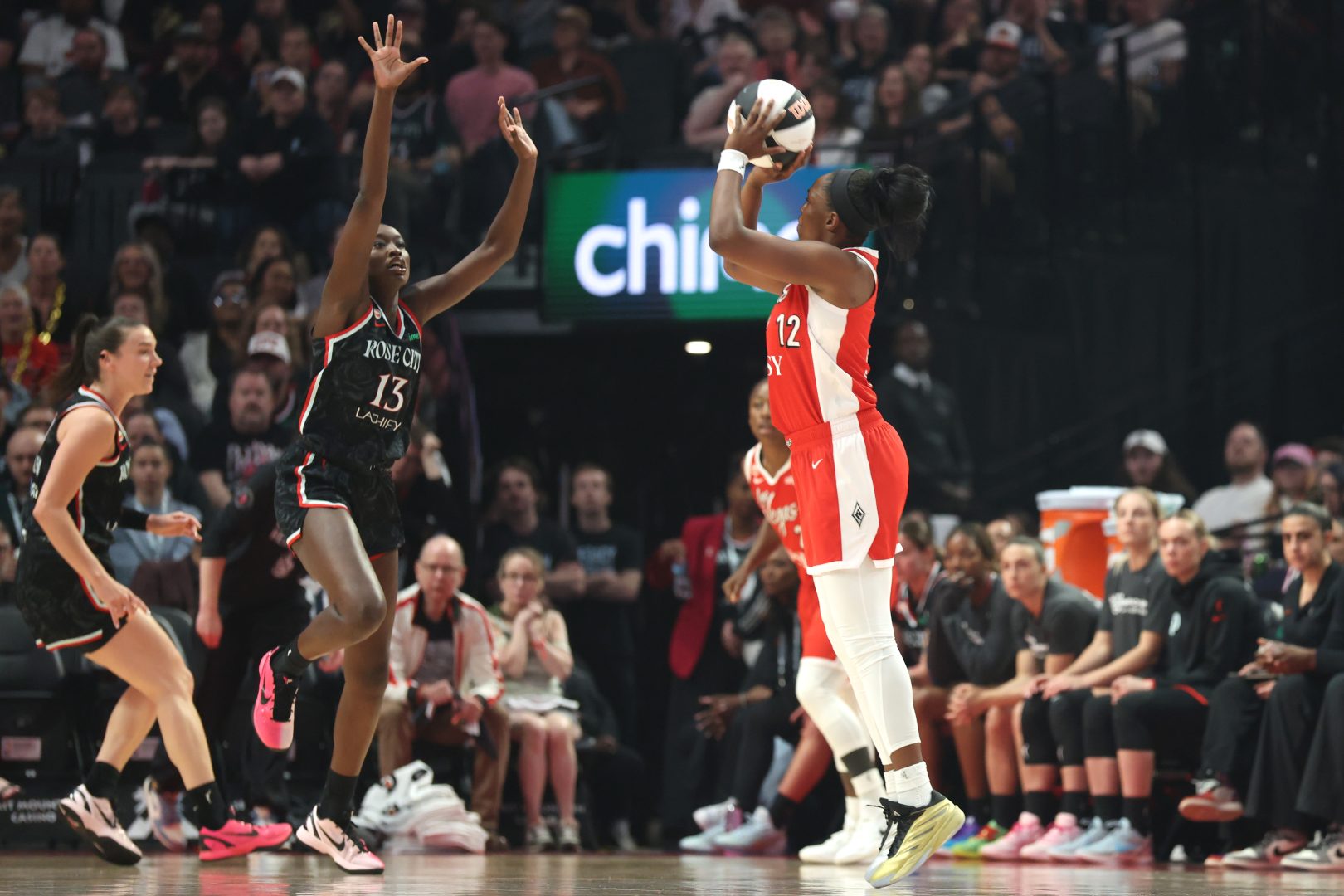 Las Vegas Aces forward Janiah Barker shoots over Portland Fire forward Nyadiew Puoch during the first half at Moda Center.