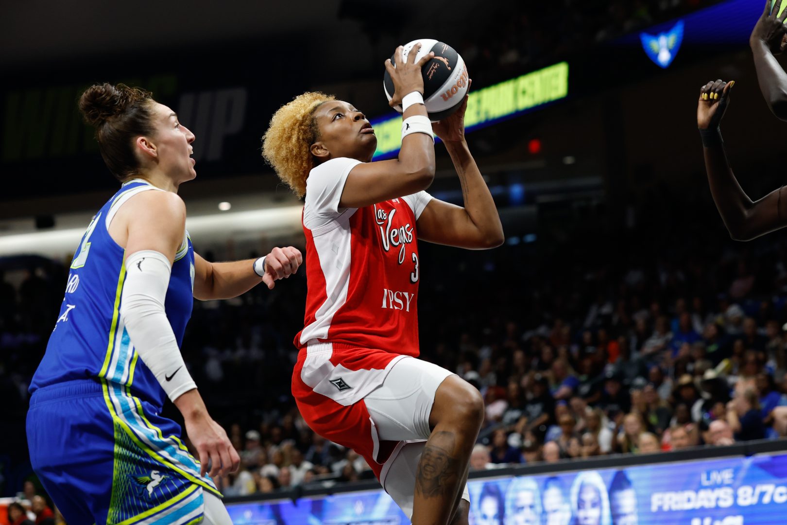 NaLyssa Smith scores inside ahead of Jessica Shepard during the first half at College Park Center.