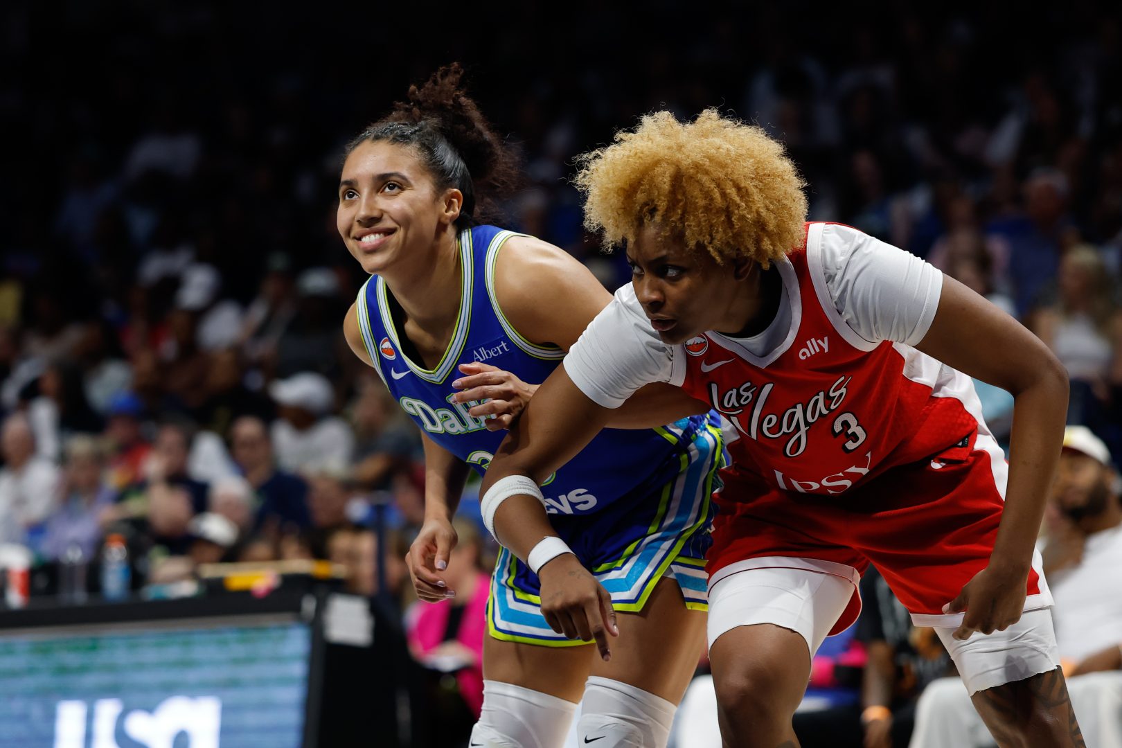 Azzi Fudd and NaLyssa Smith battle for position during the second half at College Park Center.