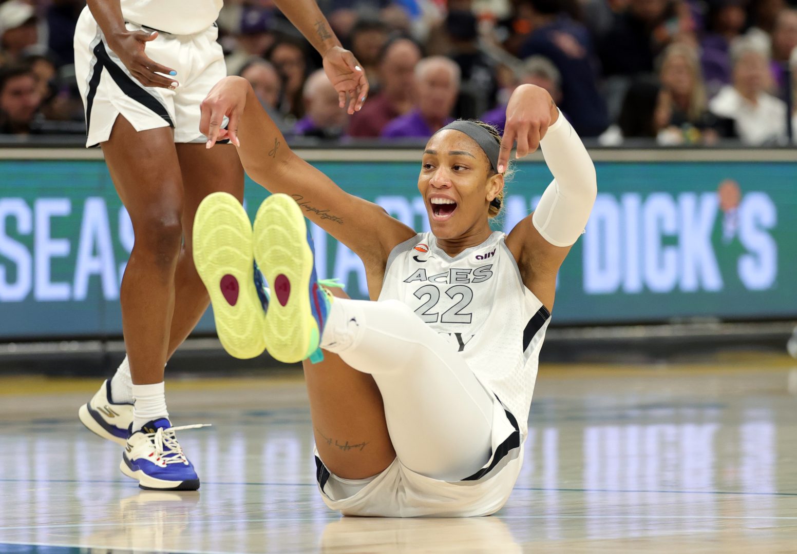A’ja Wilson celebrates after making a shot while being fouled against the Phoenix Mercury in the first half.