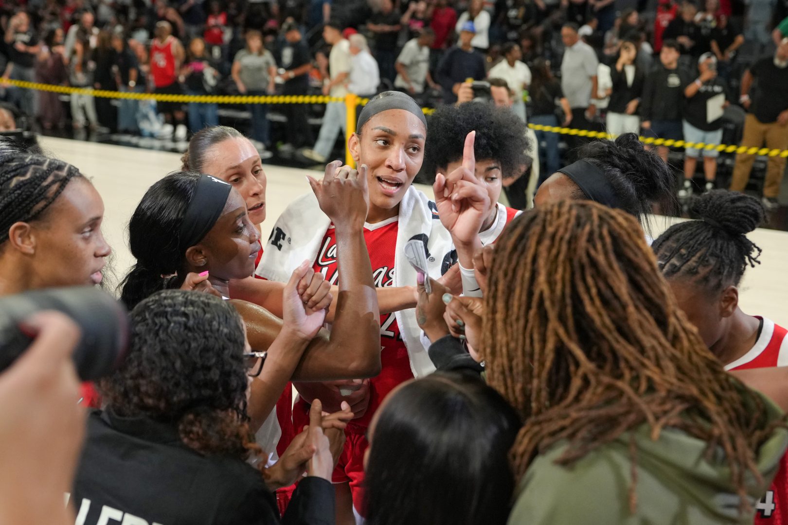 Las Vegas Aces players celebrate after defeating the Dallas Wings at Michelob ULTRA Arena.