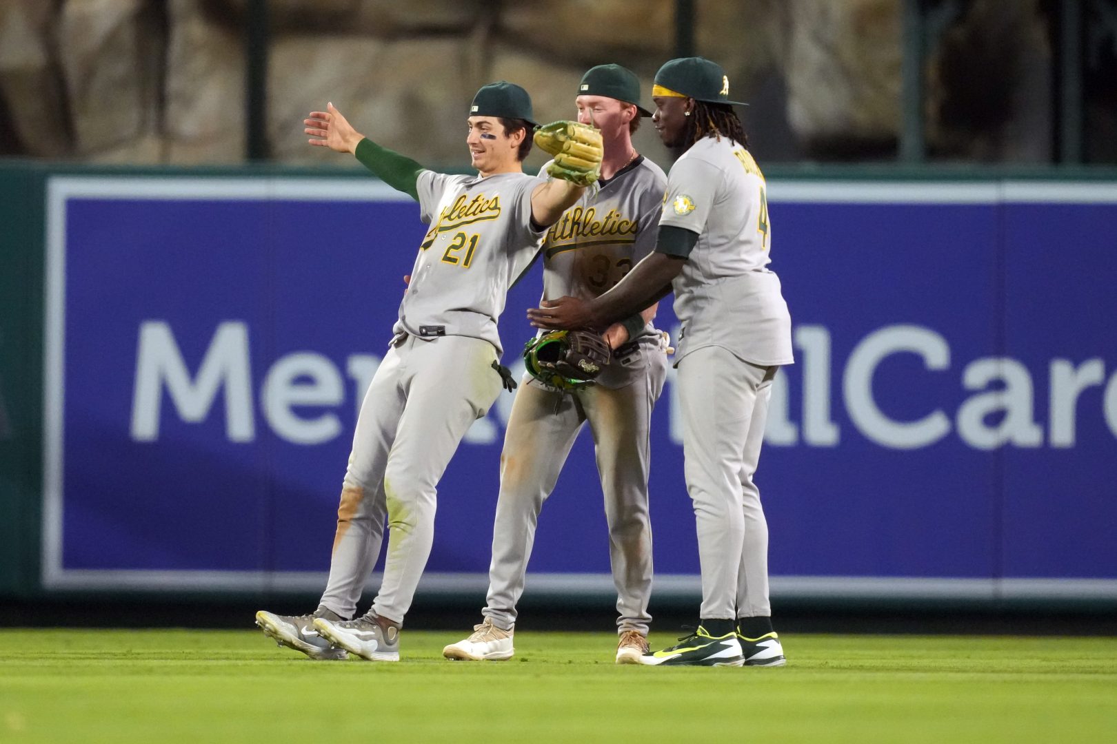 Athletics outfielders Tyler Soderstrom, Henry Bolte and Lawrence Butler celebrate after a win over the Los Angeles Angels at Angel Stadium.