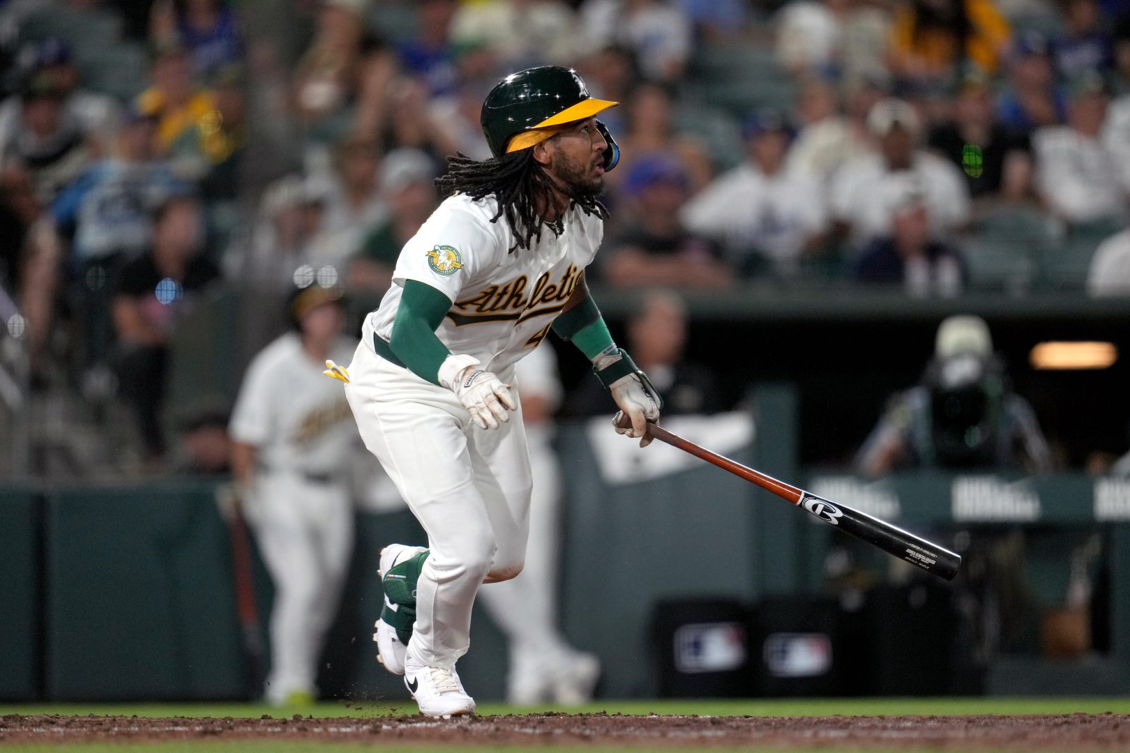 Athletics second baseman Joshua Kuroda-Grauer hits a ninth-inning double during his major league debut against the Los Angeles Dodgers.
