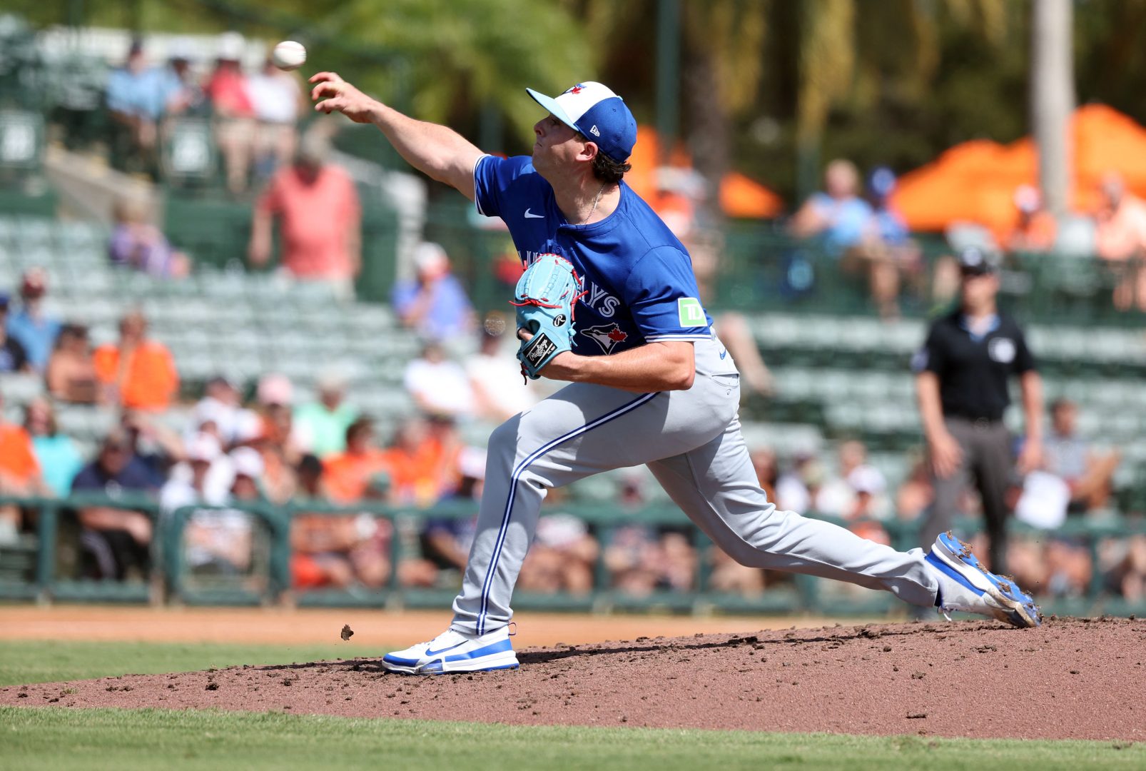 Andrew Bash pitches for the Toronto Blue Jays during a spring training game against the Baltimore Orioles.