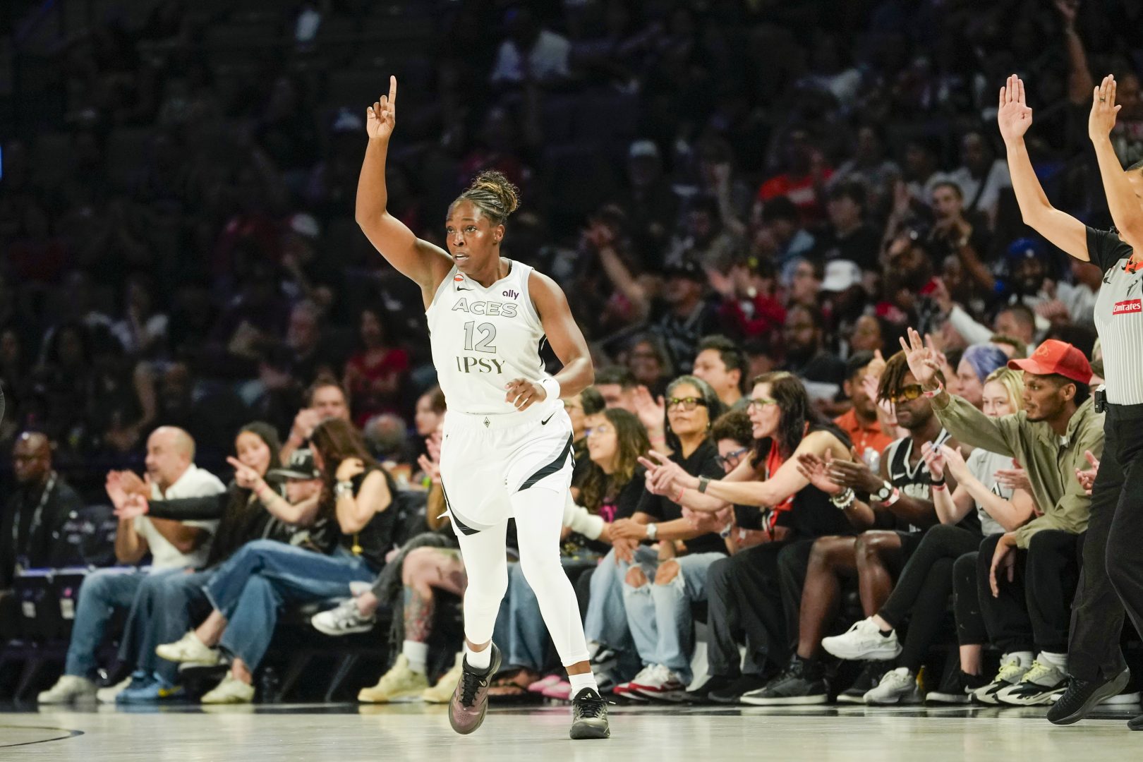 Chelsea Gray celebrates after scoring against the Portland Fire during the first quarter July 28 in Las Vegas.