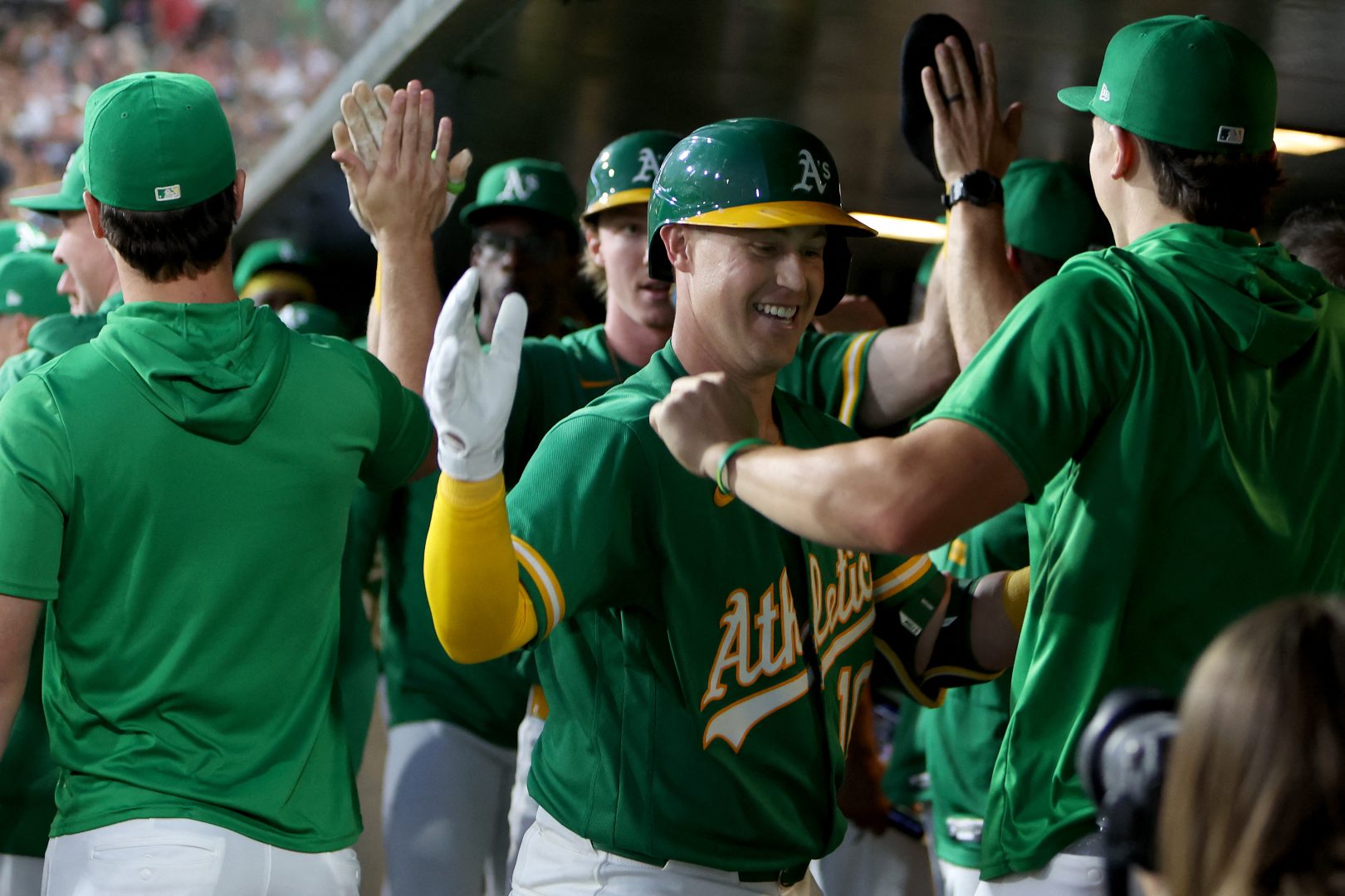 Athletics catcher Brian Serven celebrates with teammates after hitting a two-run home run against the Boston Red Sox