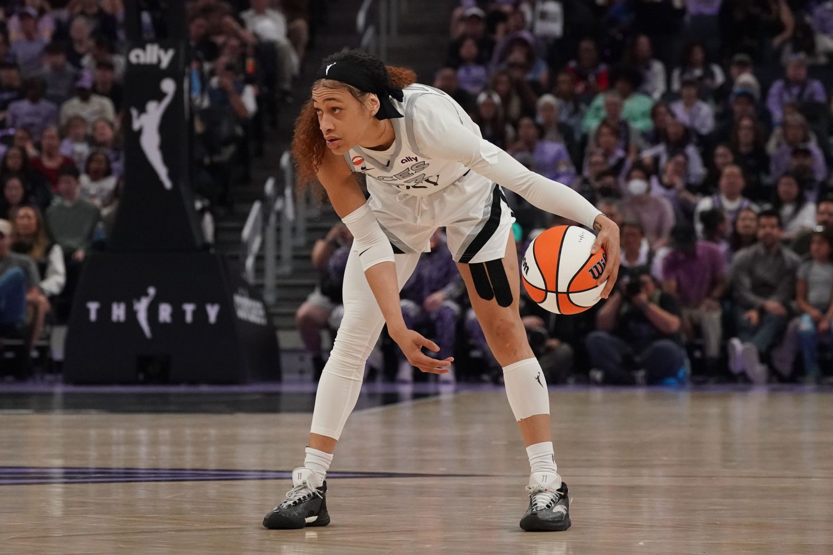 Las Vegas Aces guard Chennedy Carter dribbles against the Golden State Valkyries during the second quarter at Chase Center.