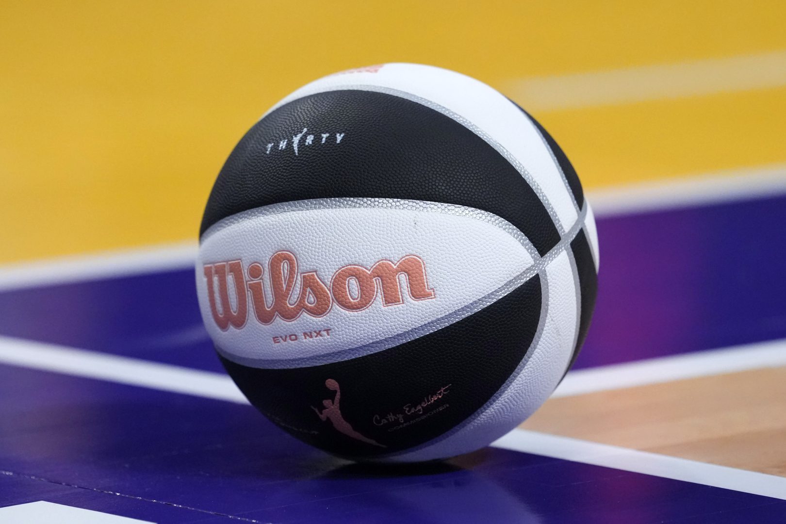 Wilson WNBA Evo NXT basketball with 30th anniversary logo on the court at Crypto.com Arena