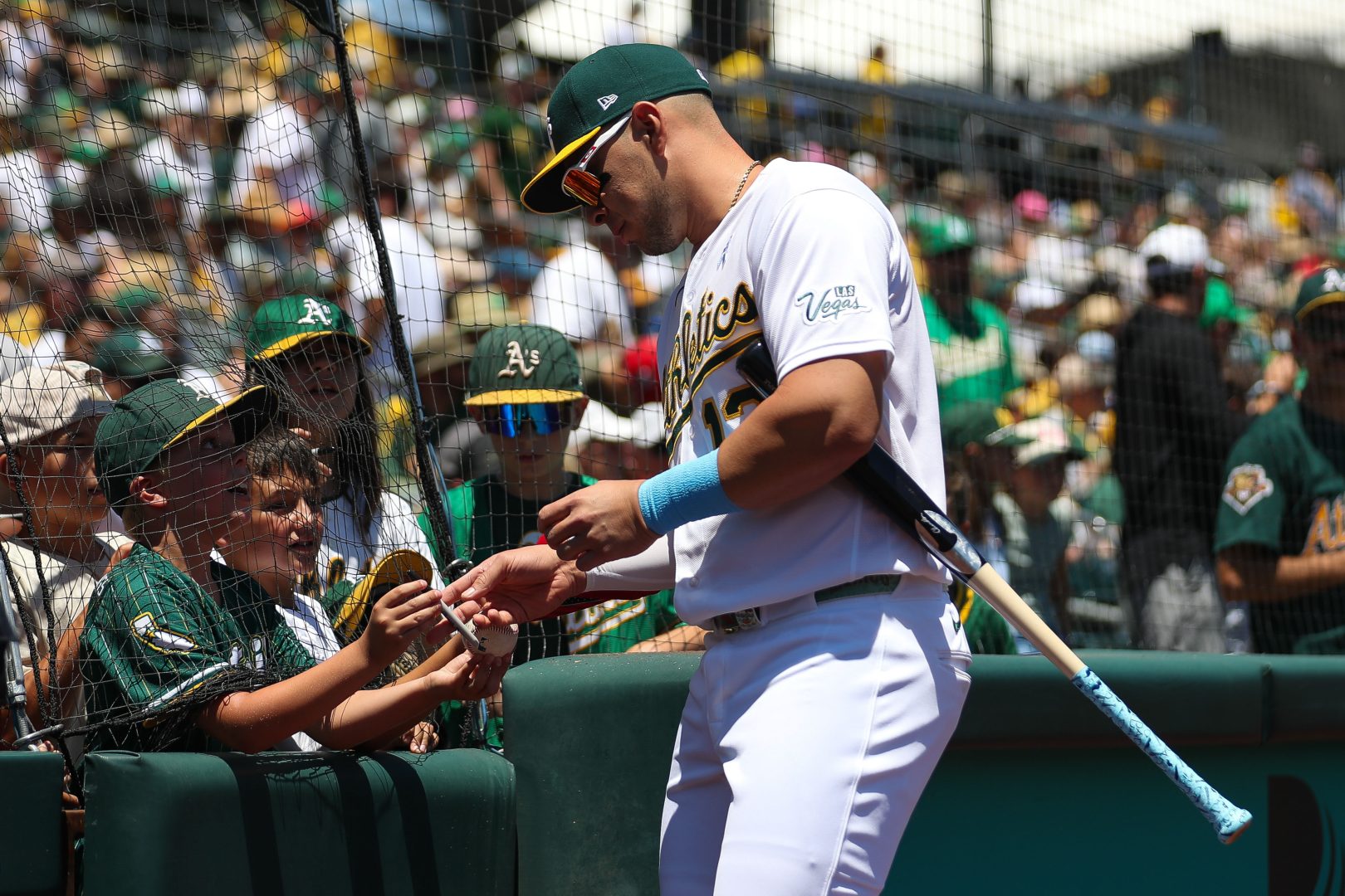 Joey Meneses signs autographs before an Athletics game at Sutter Health Park in West Sacramento.