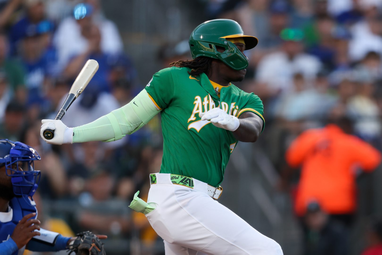 Athletics outfielder Lawrence Butler hits an RBI groundout against the Los Angeles Dodgers at Sutter Health Park.
