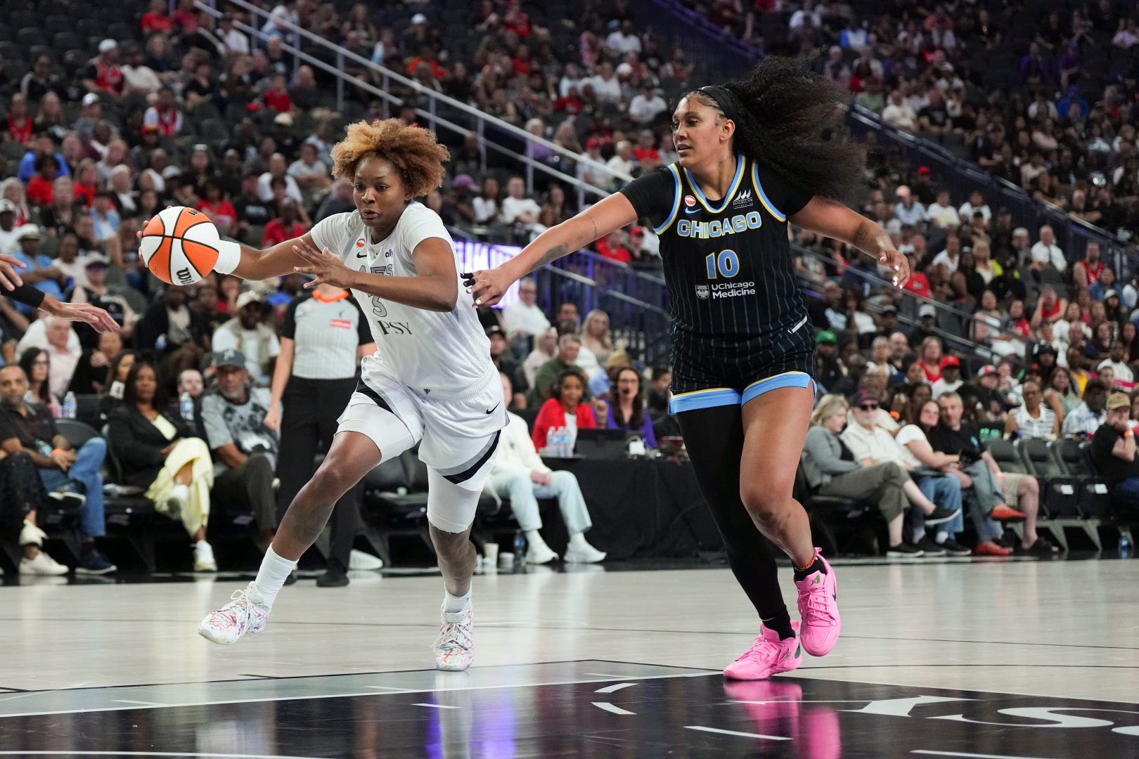 Las Vegas Aces forward NaLyssa Smith drives to the basket against Chicago Sky center Kamilla Cardoso during the second quarter at T-Mobile Arena on July 3, 2026.