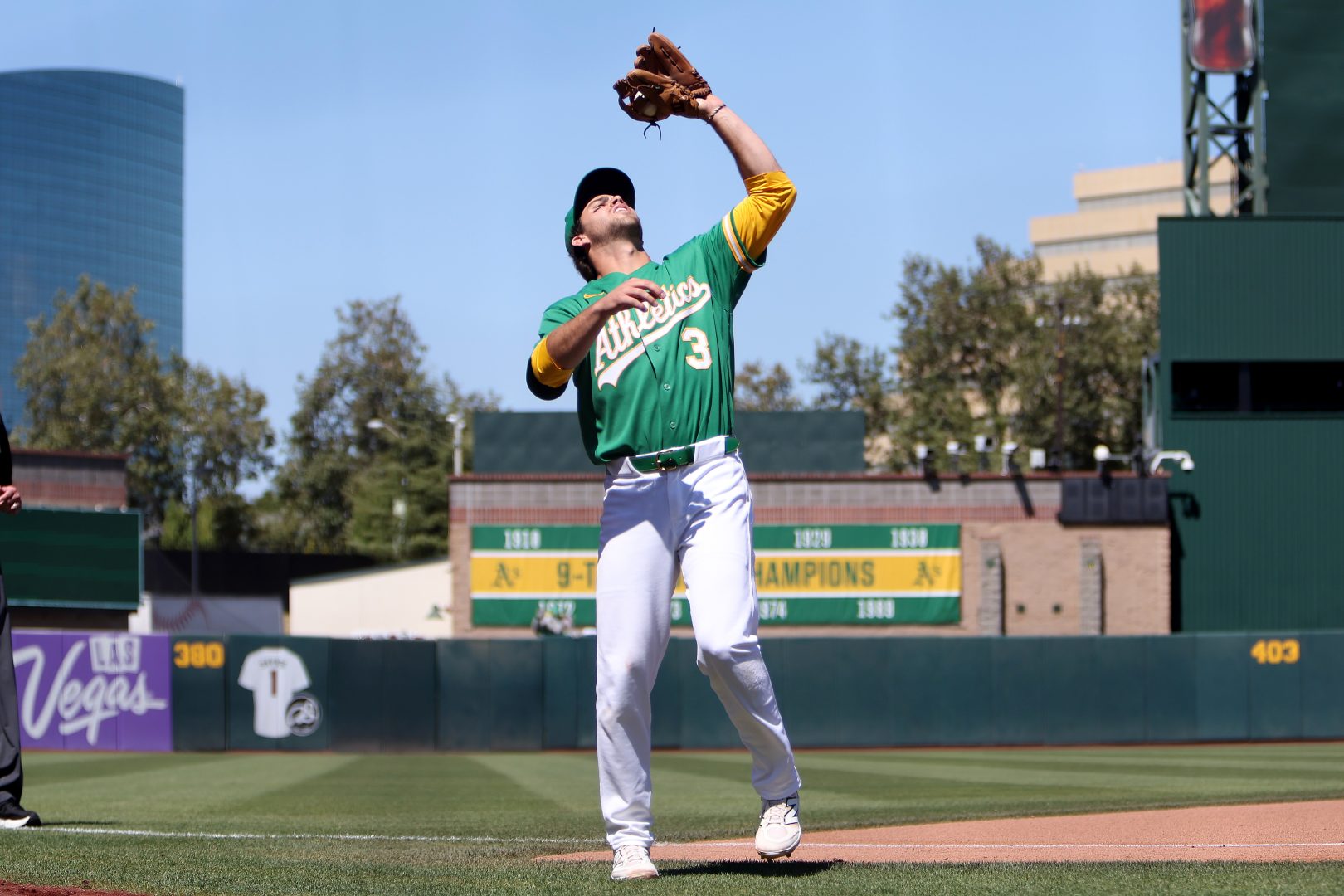 Athletics third baseman Max Muncy catches a foul pop-up against the Miami Marlins at Sutter Health Park.