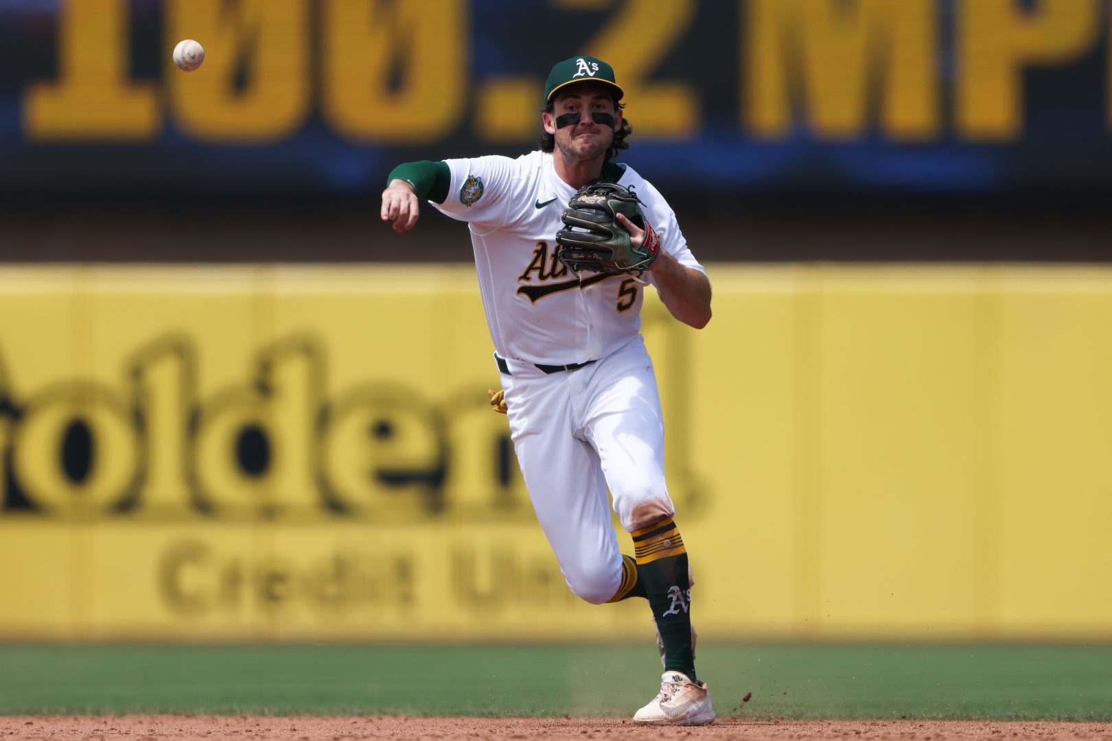 Athletics shortstop Jacob Wilson throws to first base for an out at Sutter Health Park.