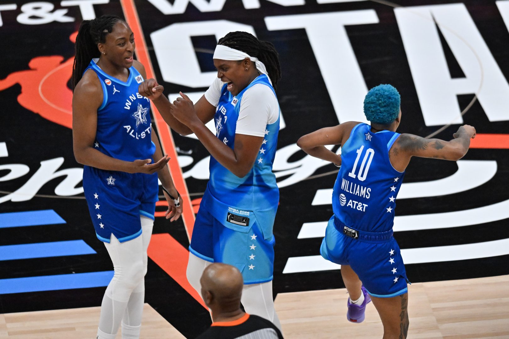 Jonquel Jones celebrates with Nneka Ogwumike during the 2026 WNBA All-Star Game at United Center after earning MVP honors.