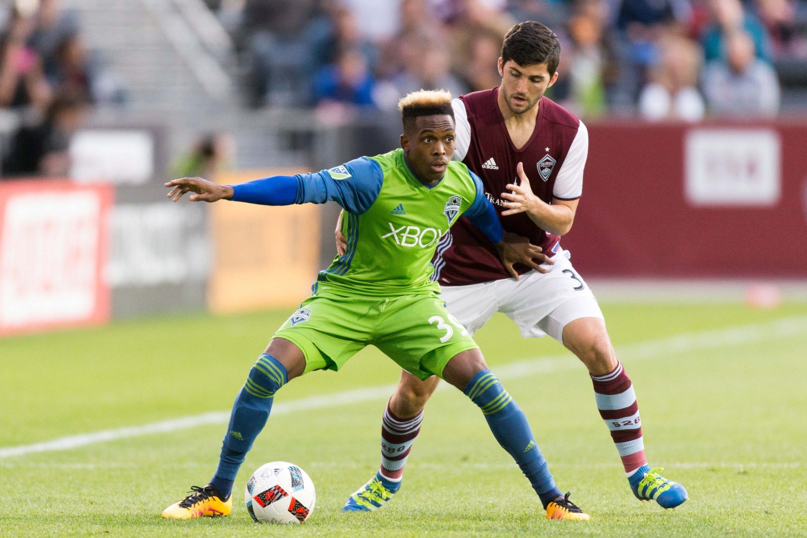 Oalex Anderson battles Colorado Rapids defender Eric Miller for the ball during a 2016 MLS match