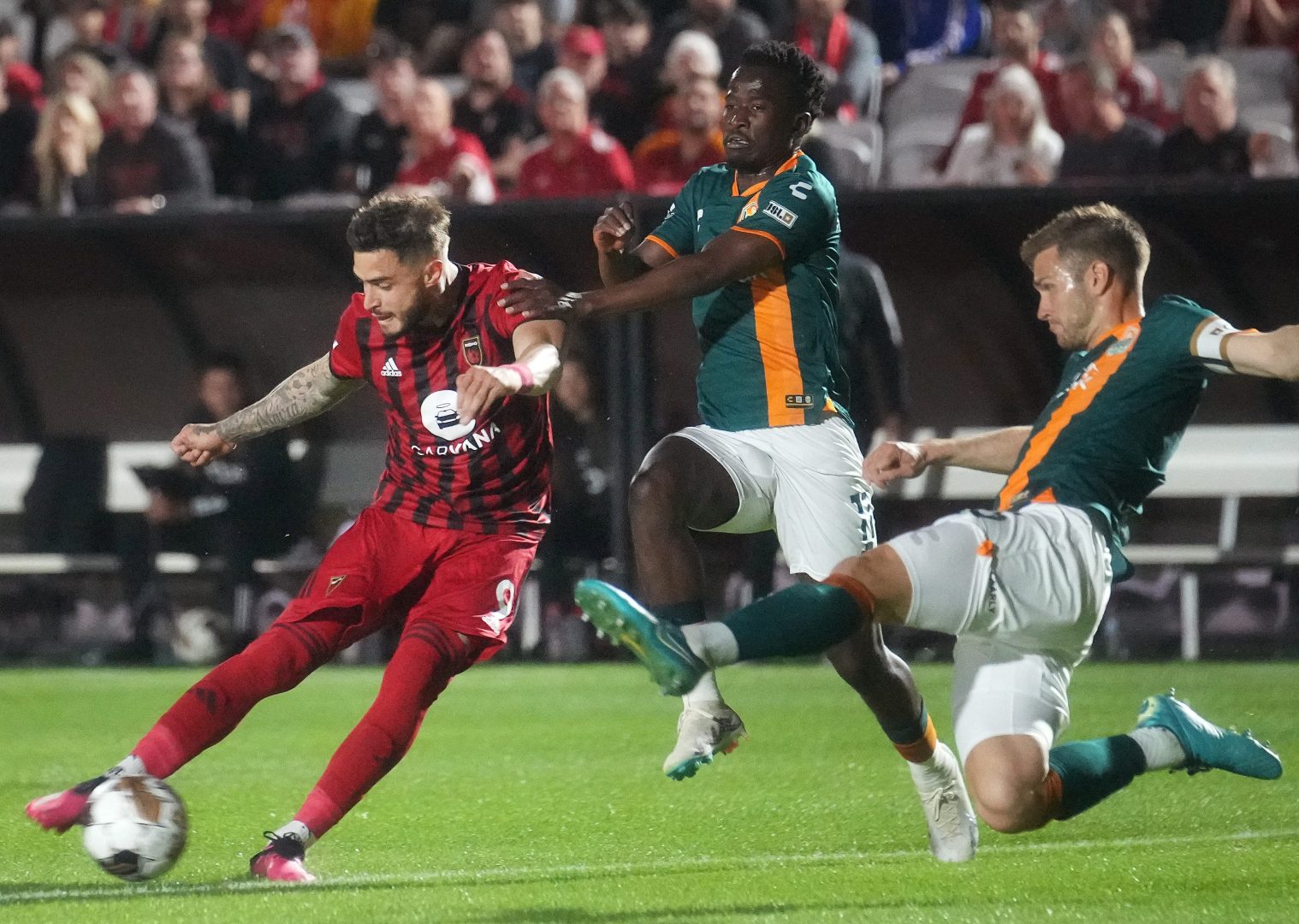 Phoenix Rising FC forward Manuel Arteaga strikes the ball against San Diego Loyal SC