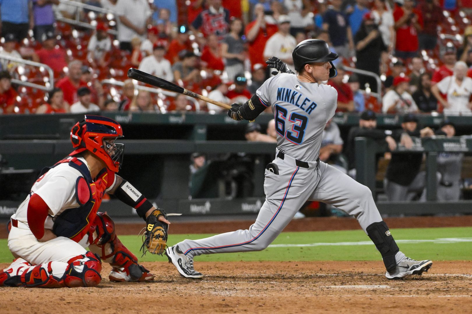 Jack Winkler hits an RBI single for the Miami Marlins against the St. Louis Cardinals at Busch Stadium.