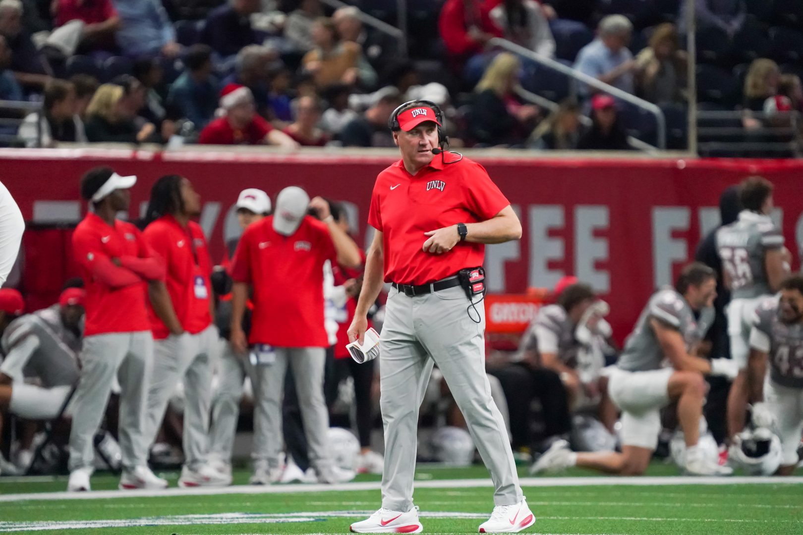 UNLV head coach Dan Mullen stands on the field during the Frisco Bowl against Ohio