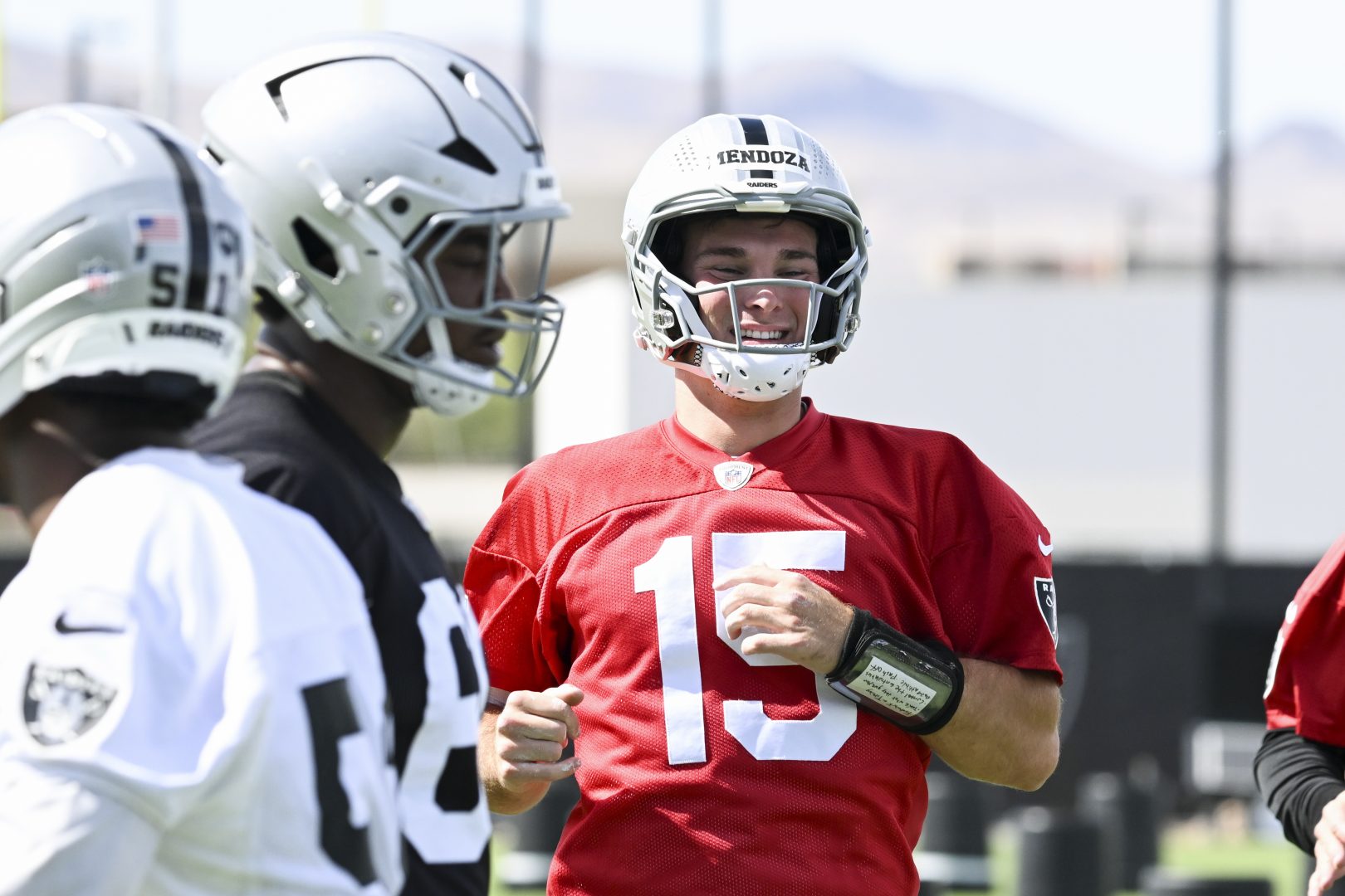 Las Vegas Raiders quarterback Fernando Mendoza warms up during organized team activities in Henderson