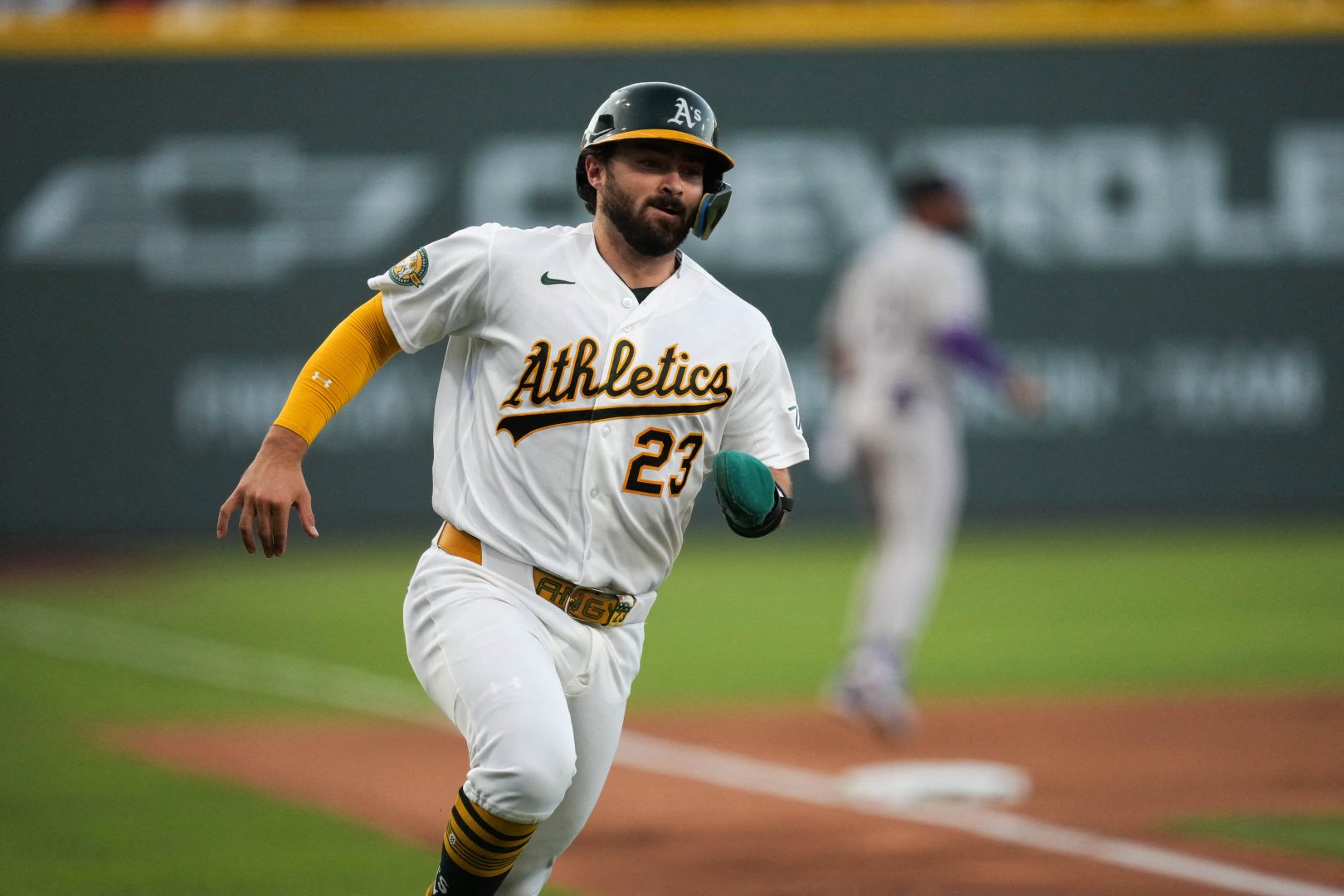 Athletics catcher Shea Langeliers scores against the Colorado Rockies at Las Vegas Ballpark