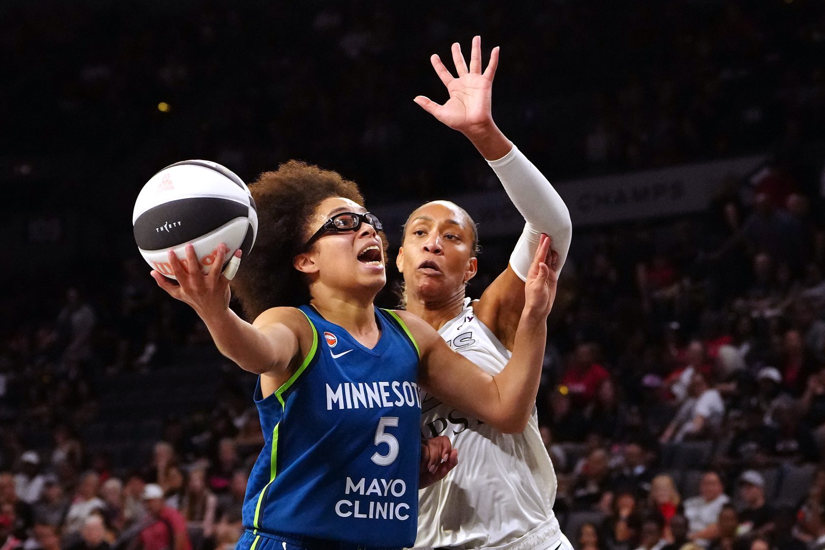 Minnesota Lynx guard Olivia Miles looks to shoot in front of Las Vegas Aces center A'ja Wilson