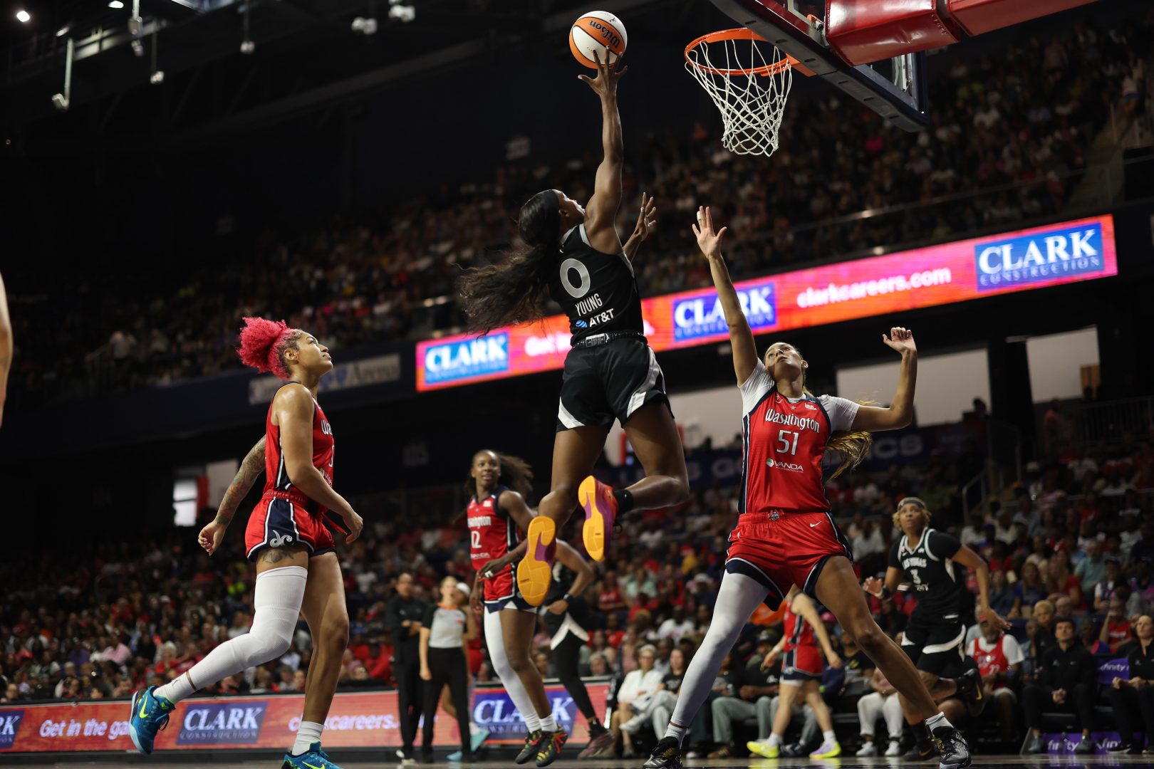 Las Vegas Aces guard Jackie Young shoots over Washington Mystics center Lauren Betts
