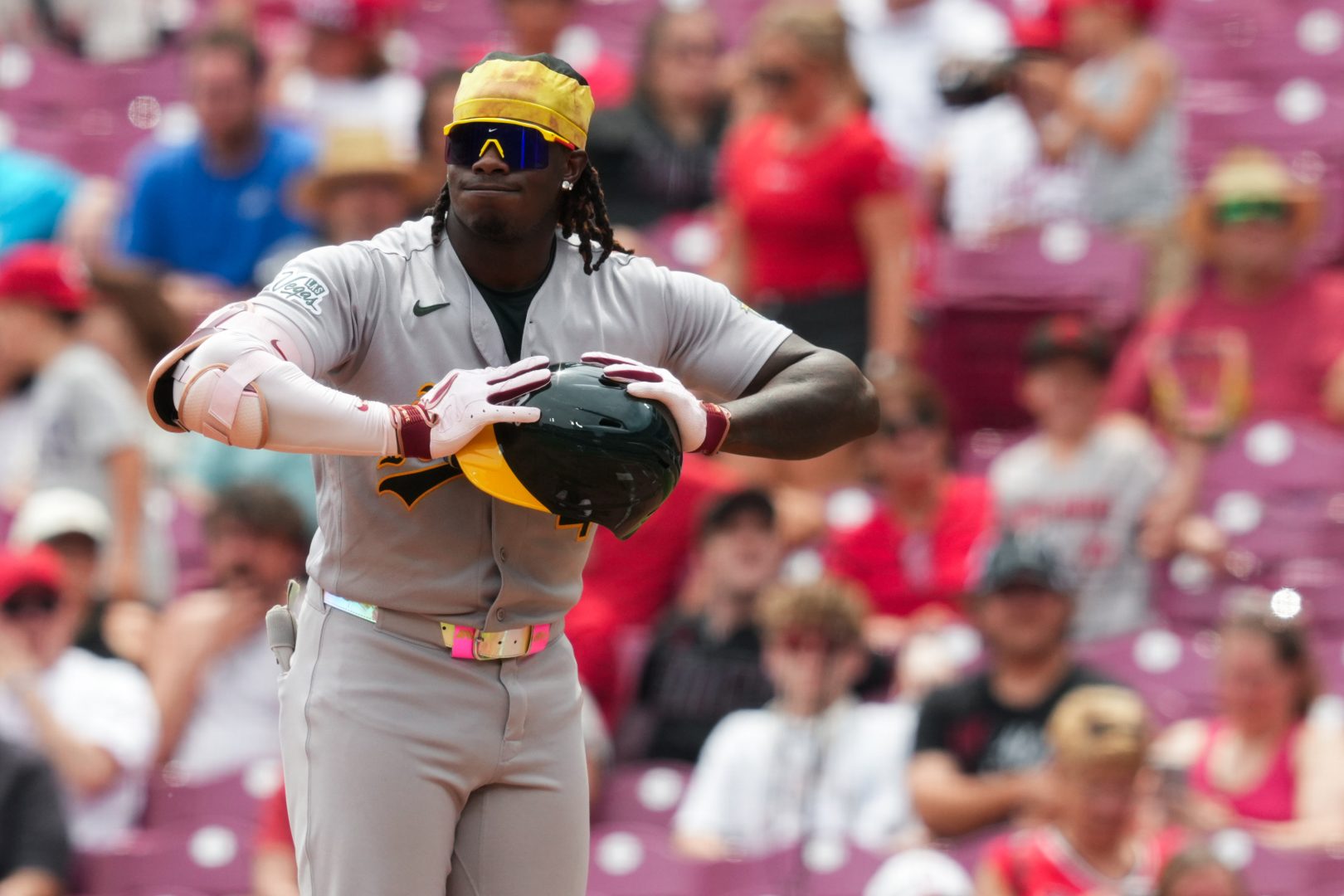 Athletics outfielder Lawrence Butler reacts after grounding out against the Cincinnati Reds