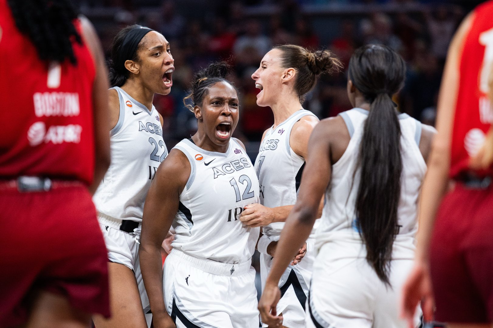 Chelsea Gray celebrates with Steph Talbot, Jackie Young and A'ja Wilson after tying the game against the Indiana Fever