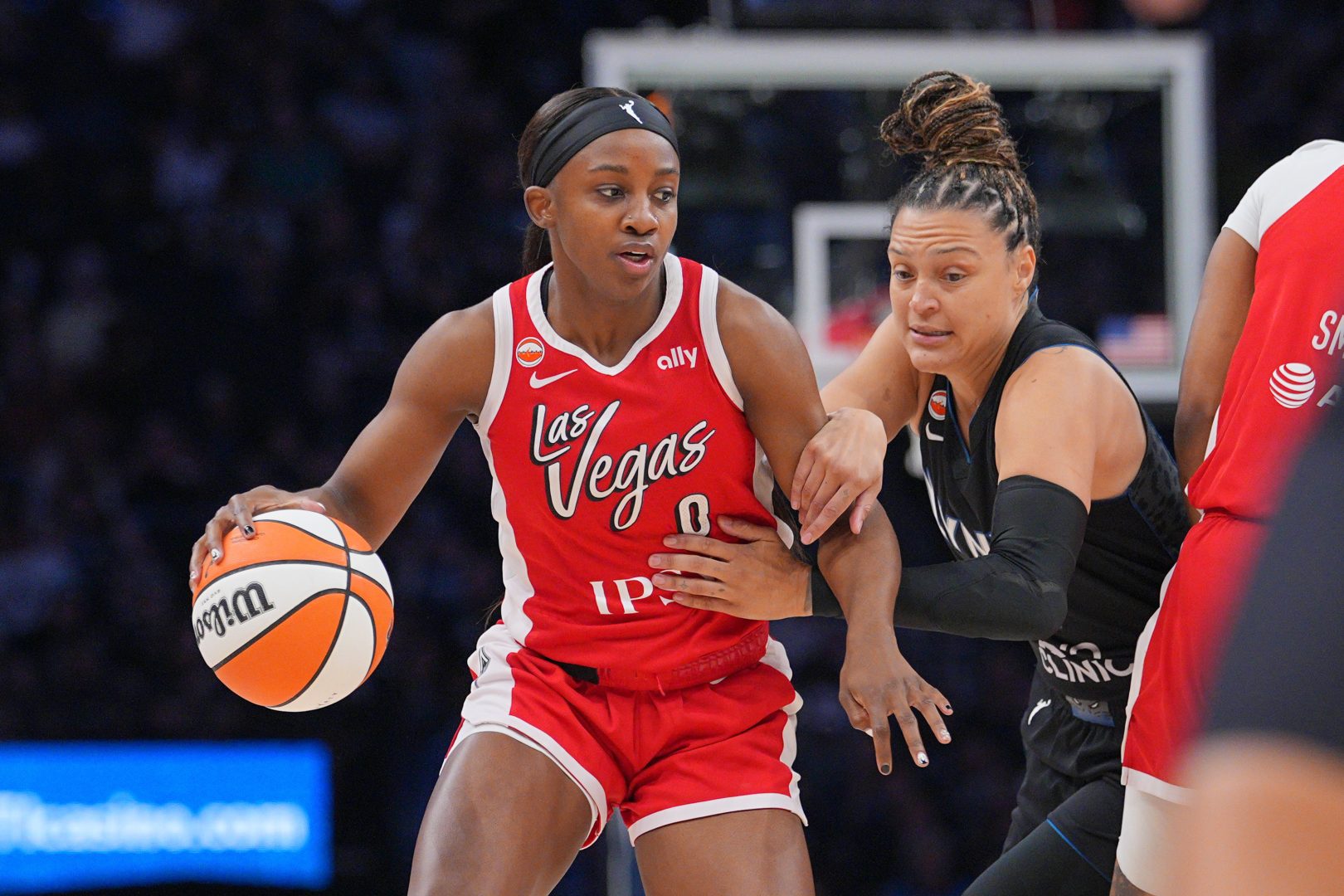 Jackie Young dribbles against Kayla McBride during the first quarter at Target Center.